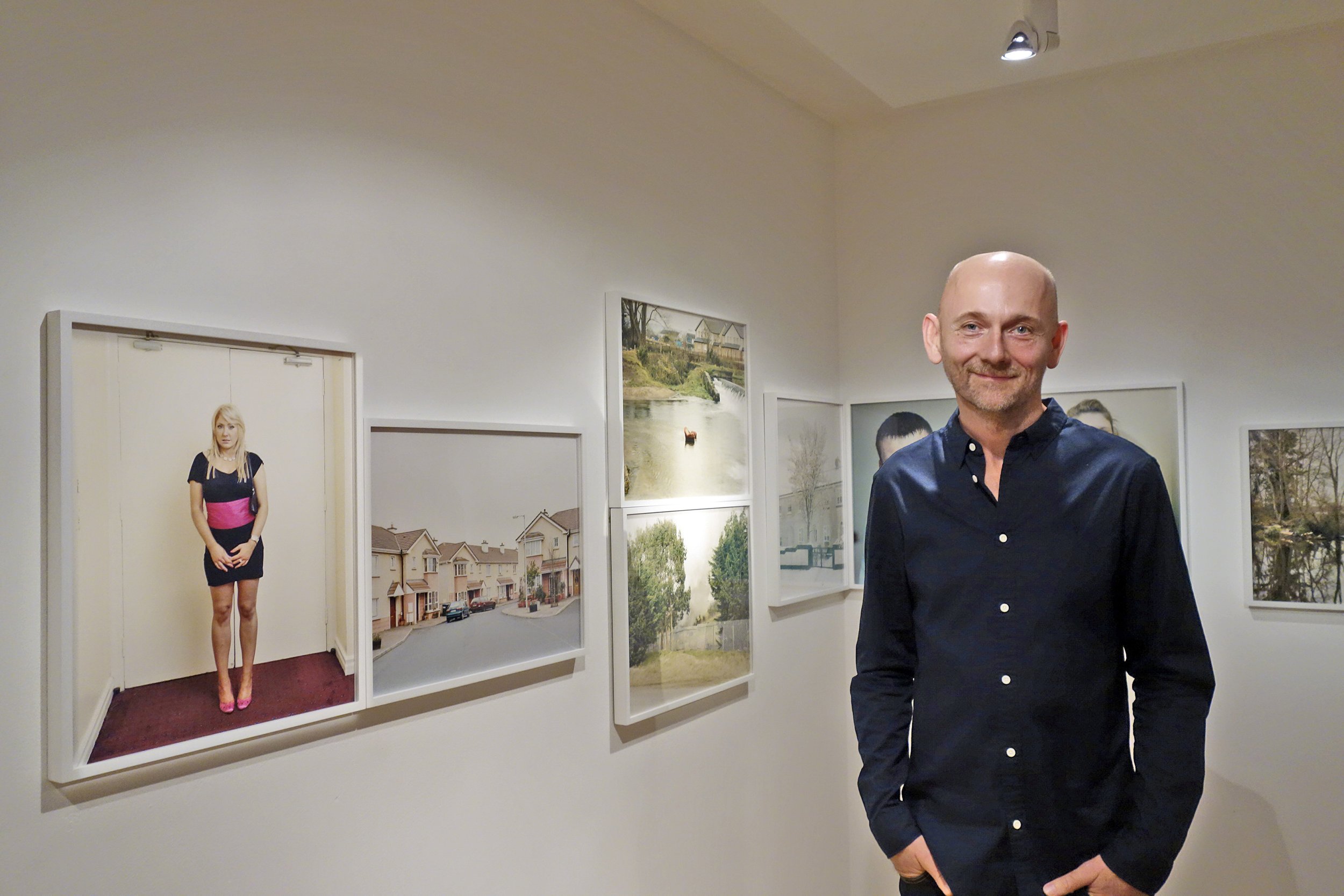  Photographer Enda Bowe with his work 