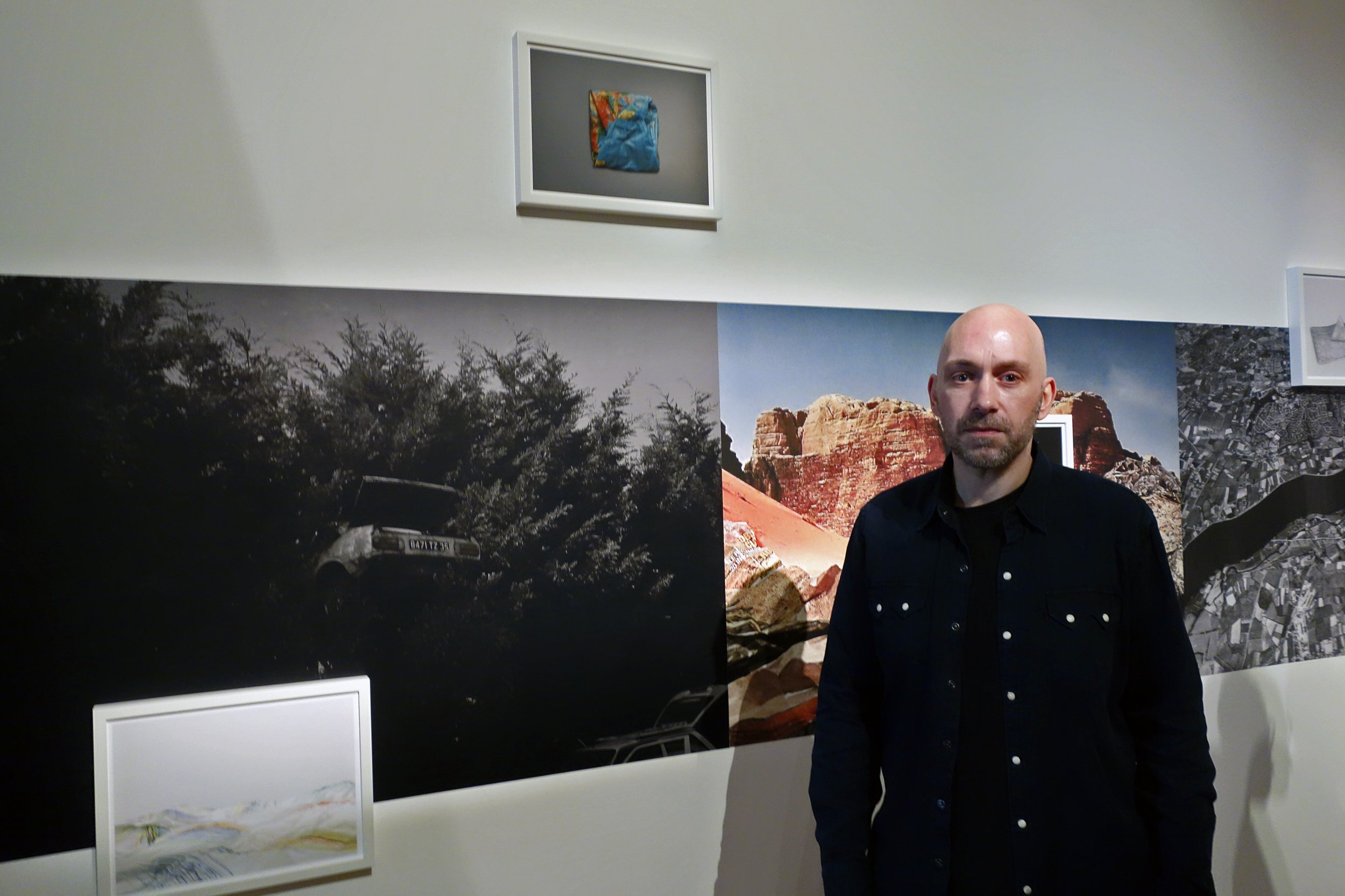  Photographer Michael Le Belhomme with his work 