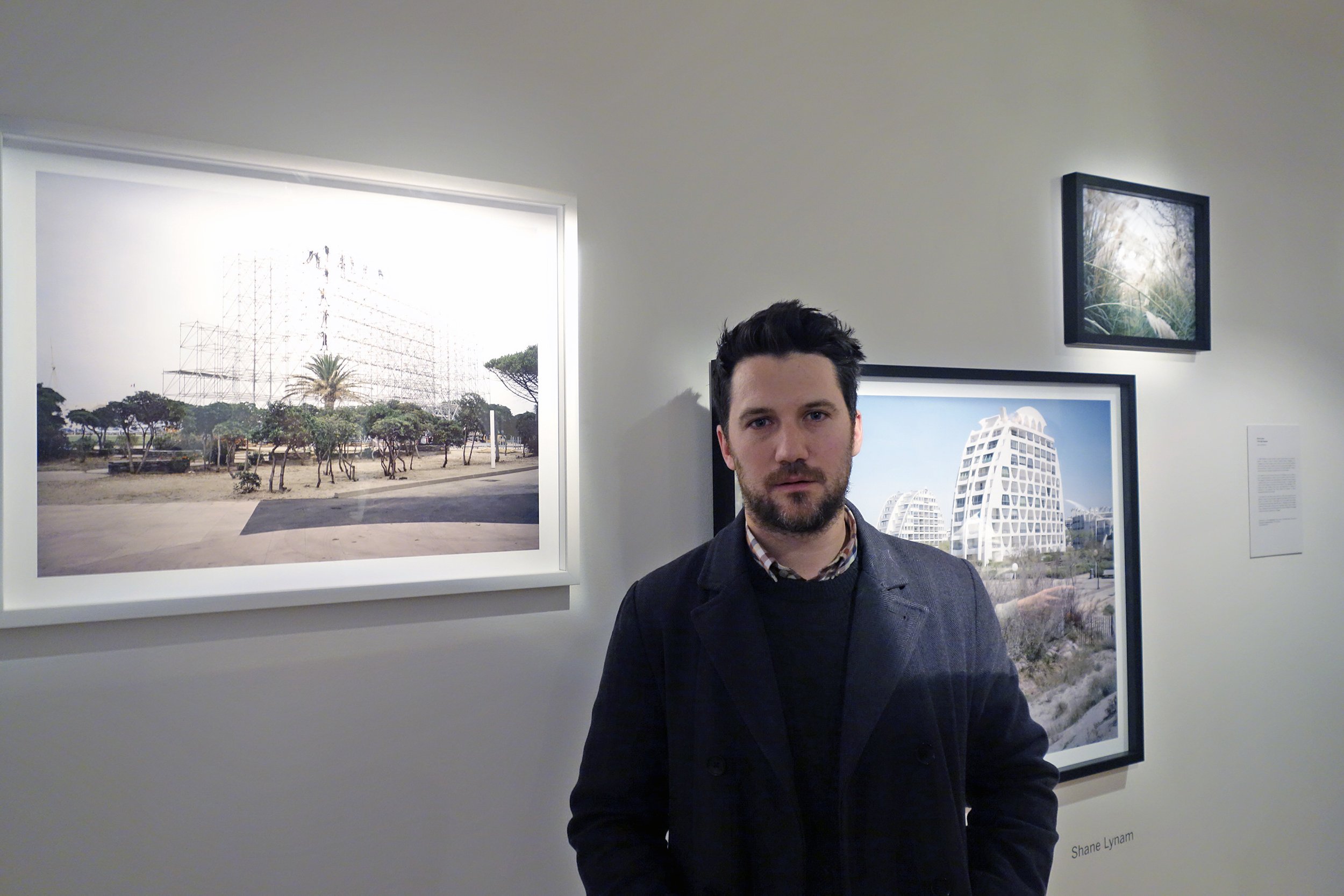  Photographer Shane Lynam with his work 