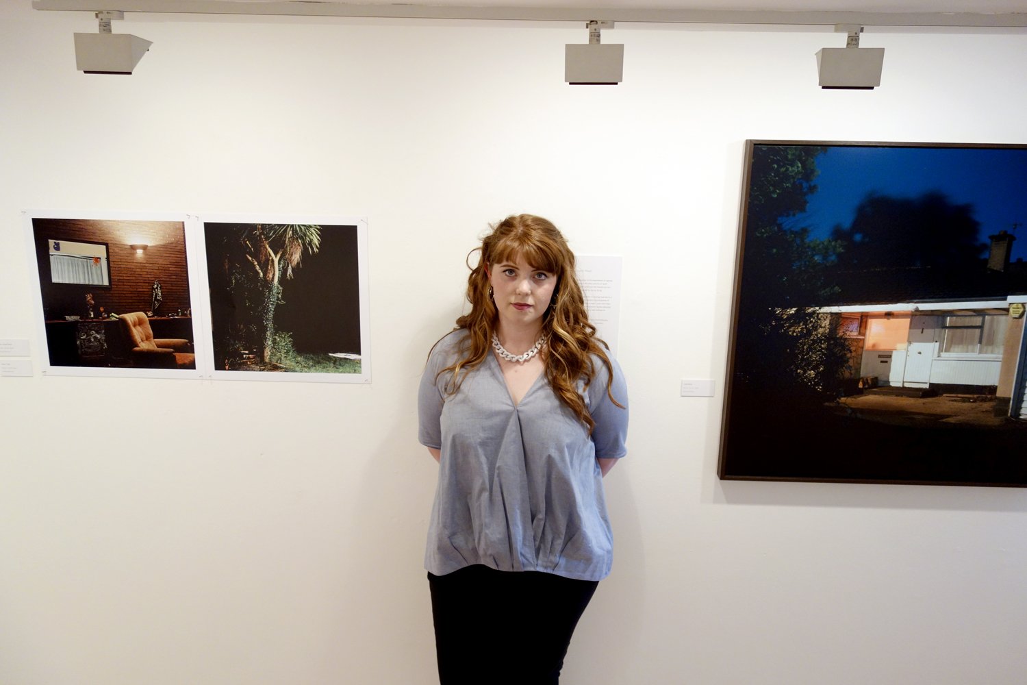  Photographer Emma Maguire with her work 