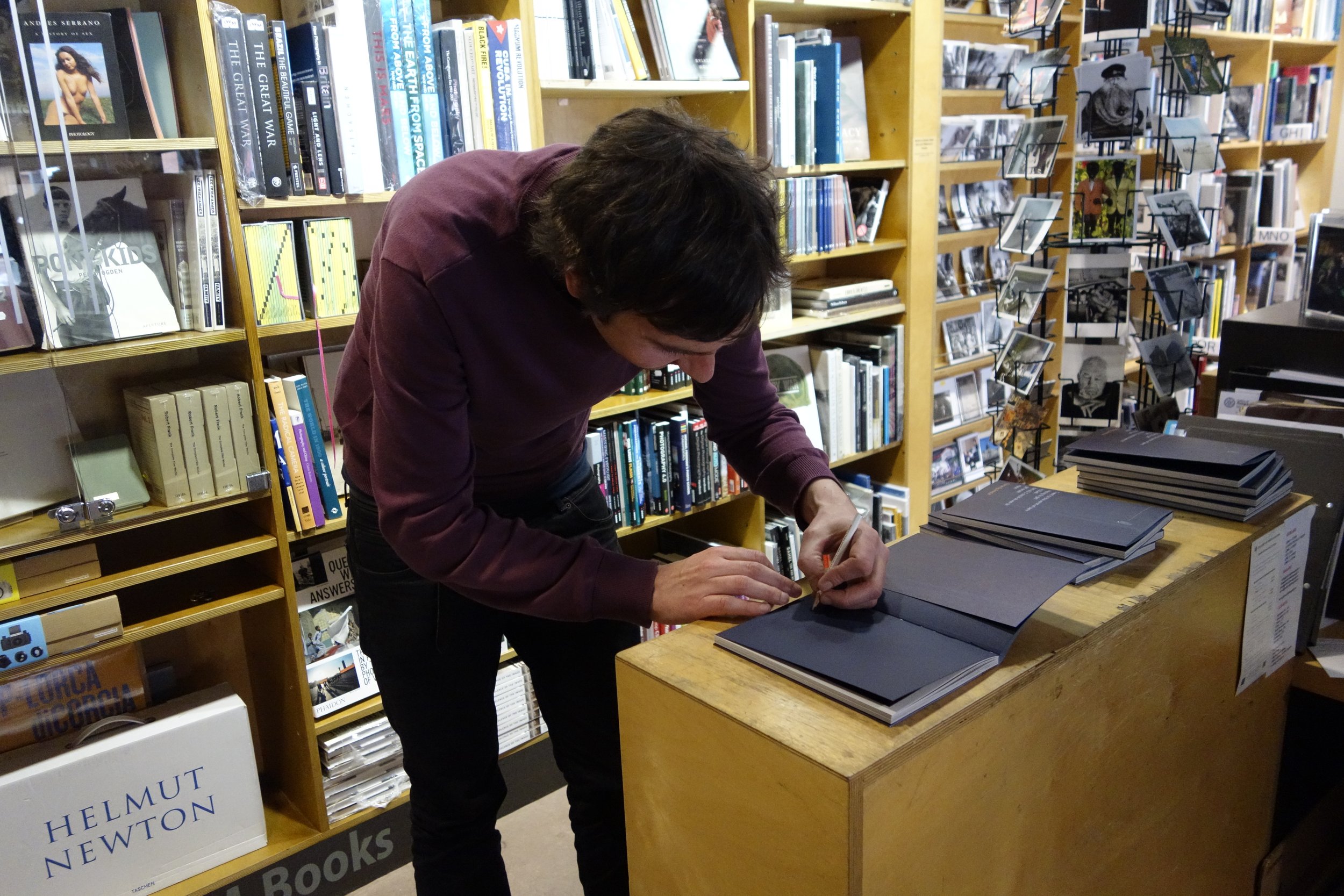  Photographer Ciarán Óg Arnold signing copies of his book 