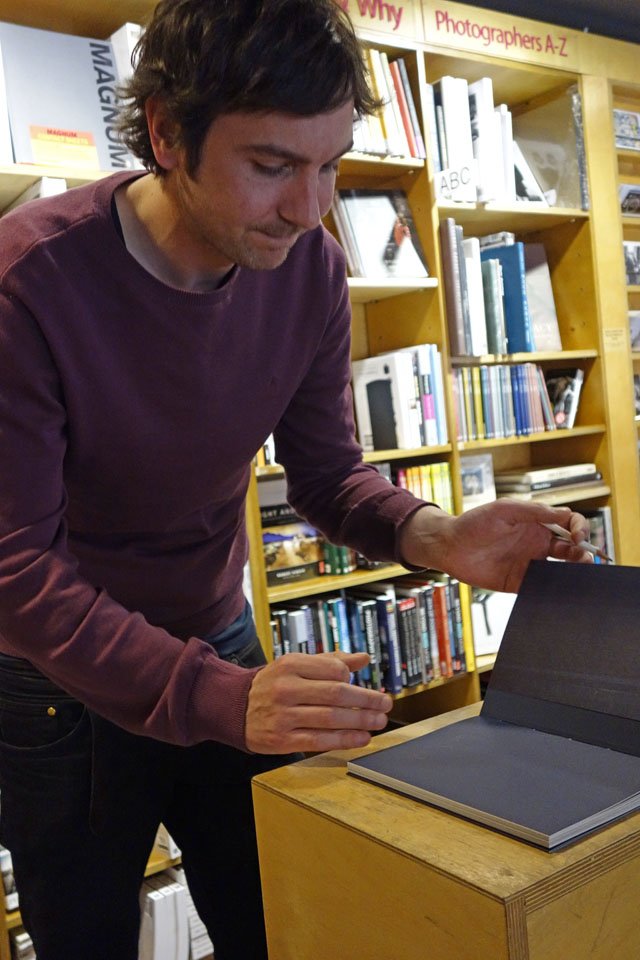  Photographer Ciarán Óg Arnold signing copies of his book 