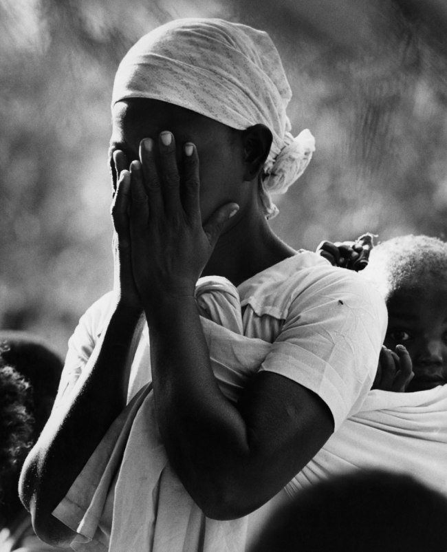 Mozambican refugee at Sunday mass, Lundo installation area, Tanzania, 1968