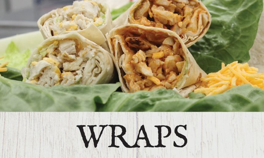 Close-up of chicken and vegetable wraps with shredded cheese on a lettuce bed.