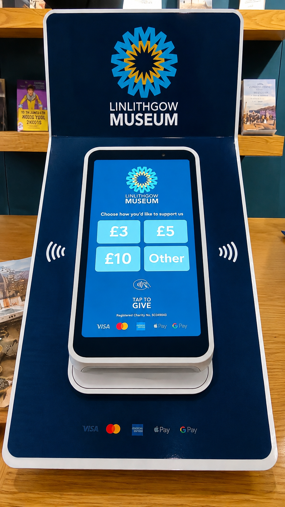 Contactless giving device at Linlithgow Museum showing £3, £5, £10 and other support options.