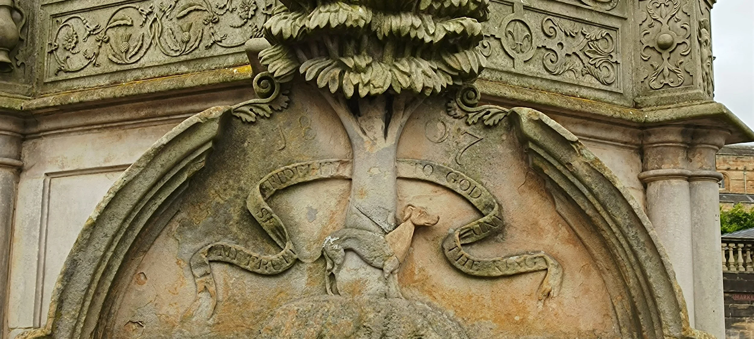 Carving of the Black Bitch legend on Linlithgow's Cross Well