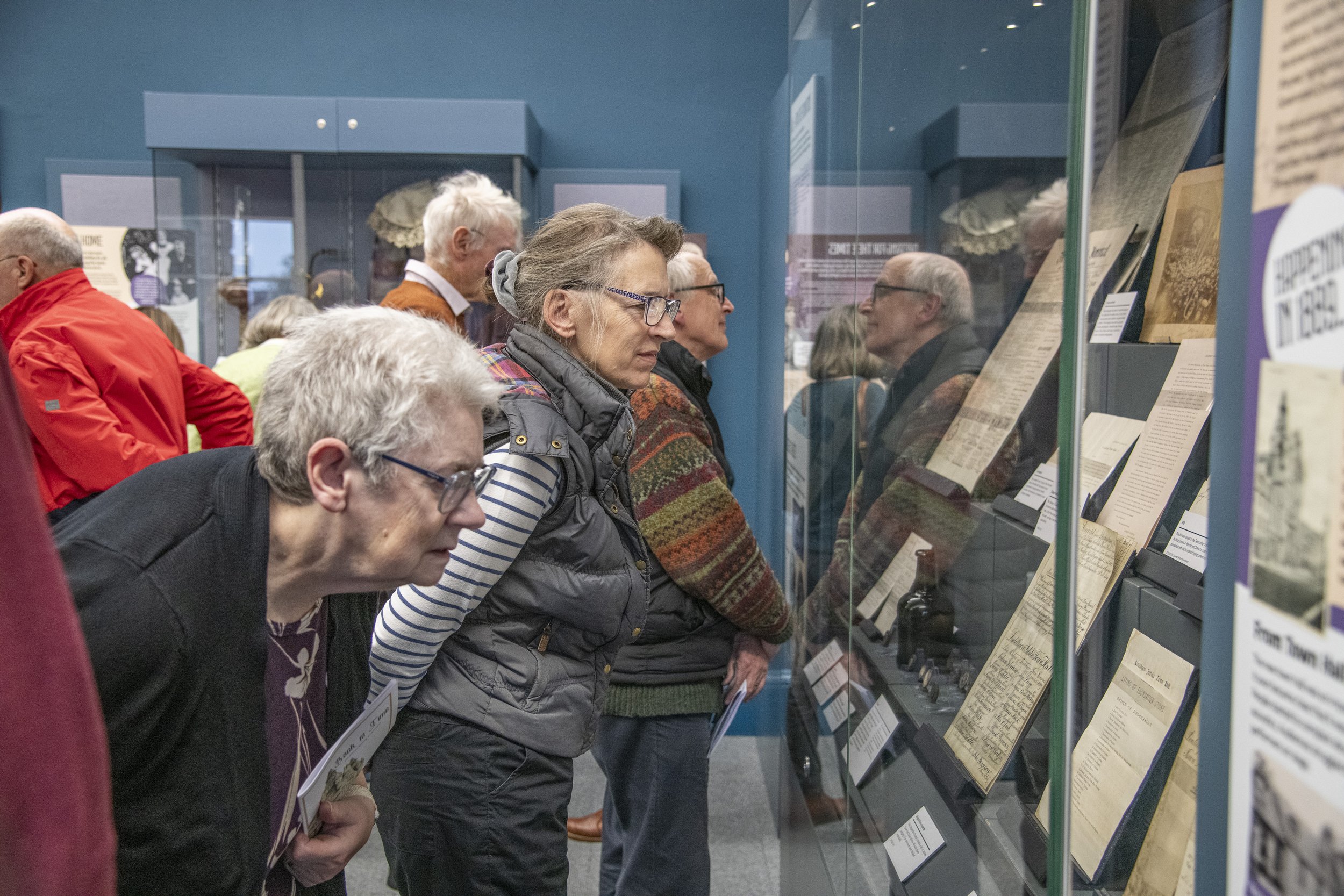 Members of the public viewing a new exhibition
