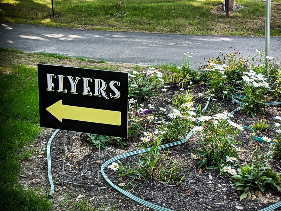 Yard sign for flyers.