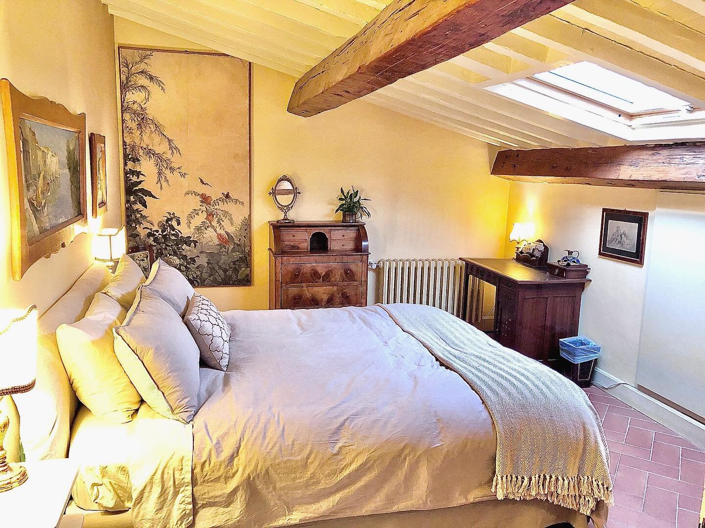 The master bedroom with antique furniture, and a skylight window with Duomo view!