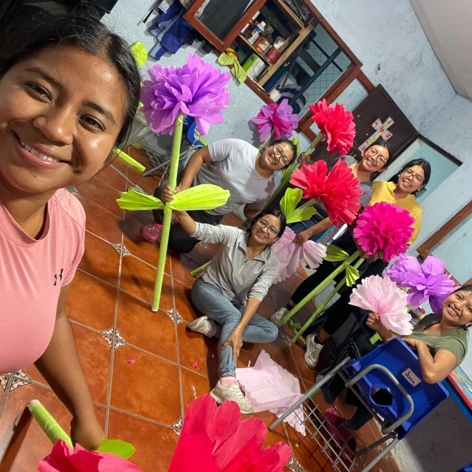 Remember our recent Mother's Day event? There's a special story behind it...
(Part 2 of 3)

After clearing the property in record time, our students and staff set out to make beautiful decorations out of paper and glue.

The day of the event, our tea