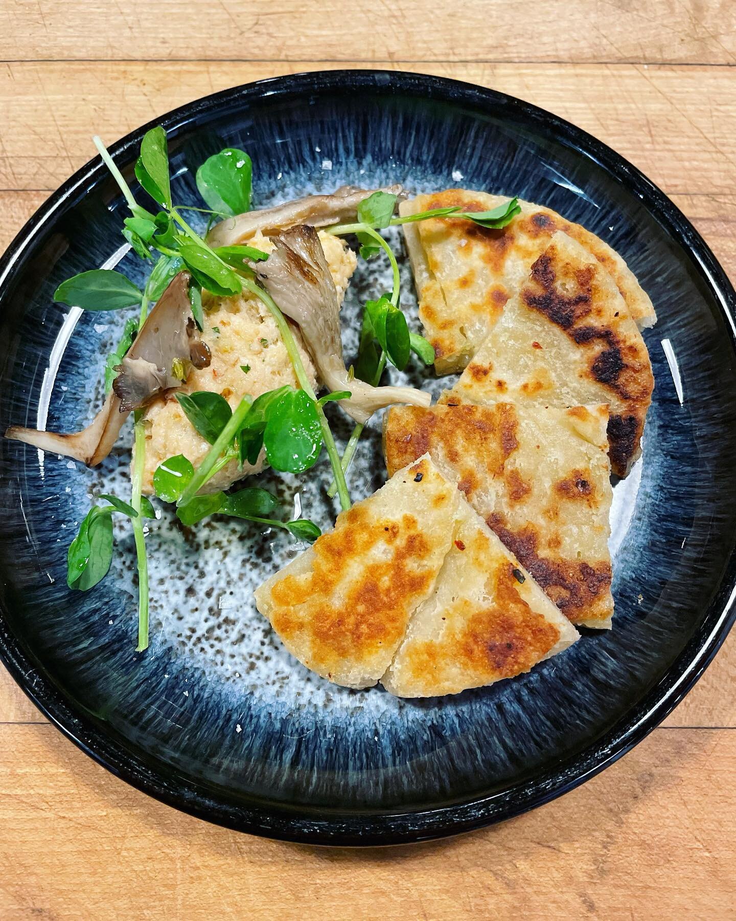 scallion pancake, salmon rillette, pickled oyster mushrooms. 

Reservations can be made by phone or on our website 🍄