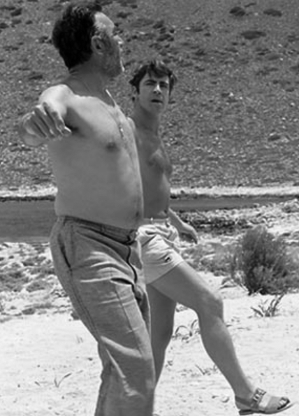 Rehearsing with Alan Bates on the beach in Crete during the filming of Zorba the Greek , 1964