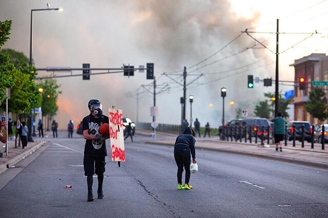 Protests continued Thursday, May 28, on University Avenue West in Saint Paul, Minnesota as buildings burned and people looted stores in the aftermath of the death of George Floyd, an unarmed man who was killed in Minneapolis Police custody while a fo