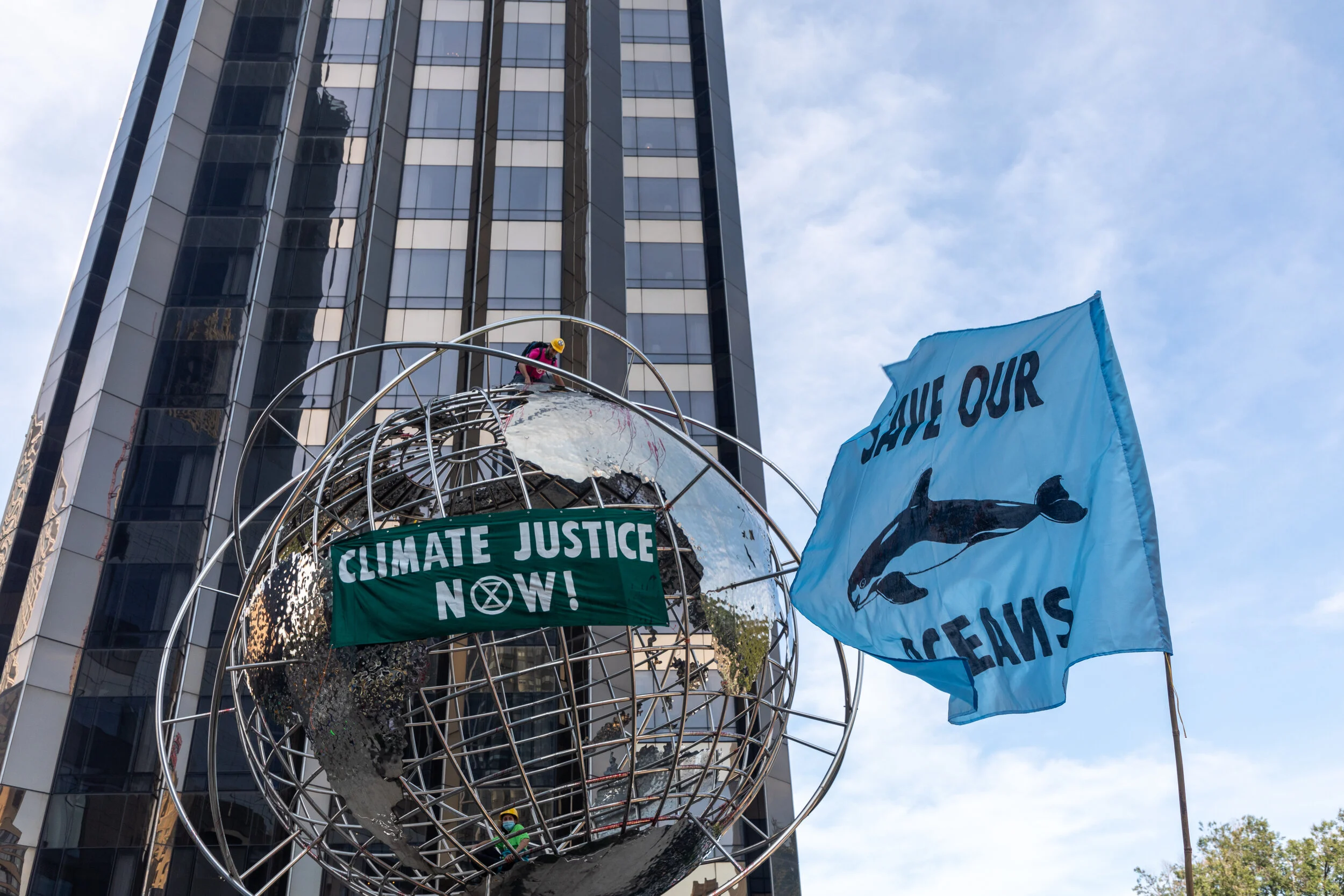 Extinction Rebellion NYC declares “We Want to Live!” as activists climb into the  globe at Columbus Circle, kicking off September Rebellion 