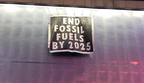 Extinction Rebellion NYC Climber Rings in the New Year with an Important Message