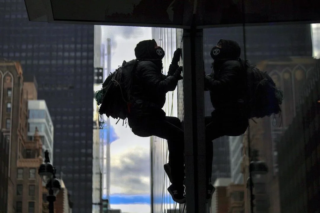 Activist Injured While Protesting “Ecocidal” Actions of Big Banks