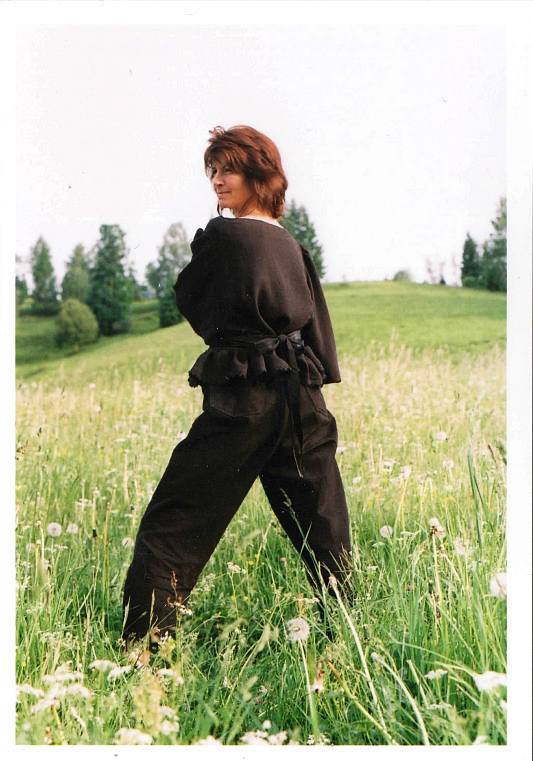 textured black blouse with patchworked belt