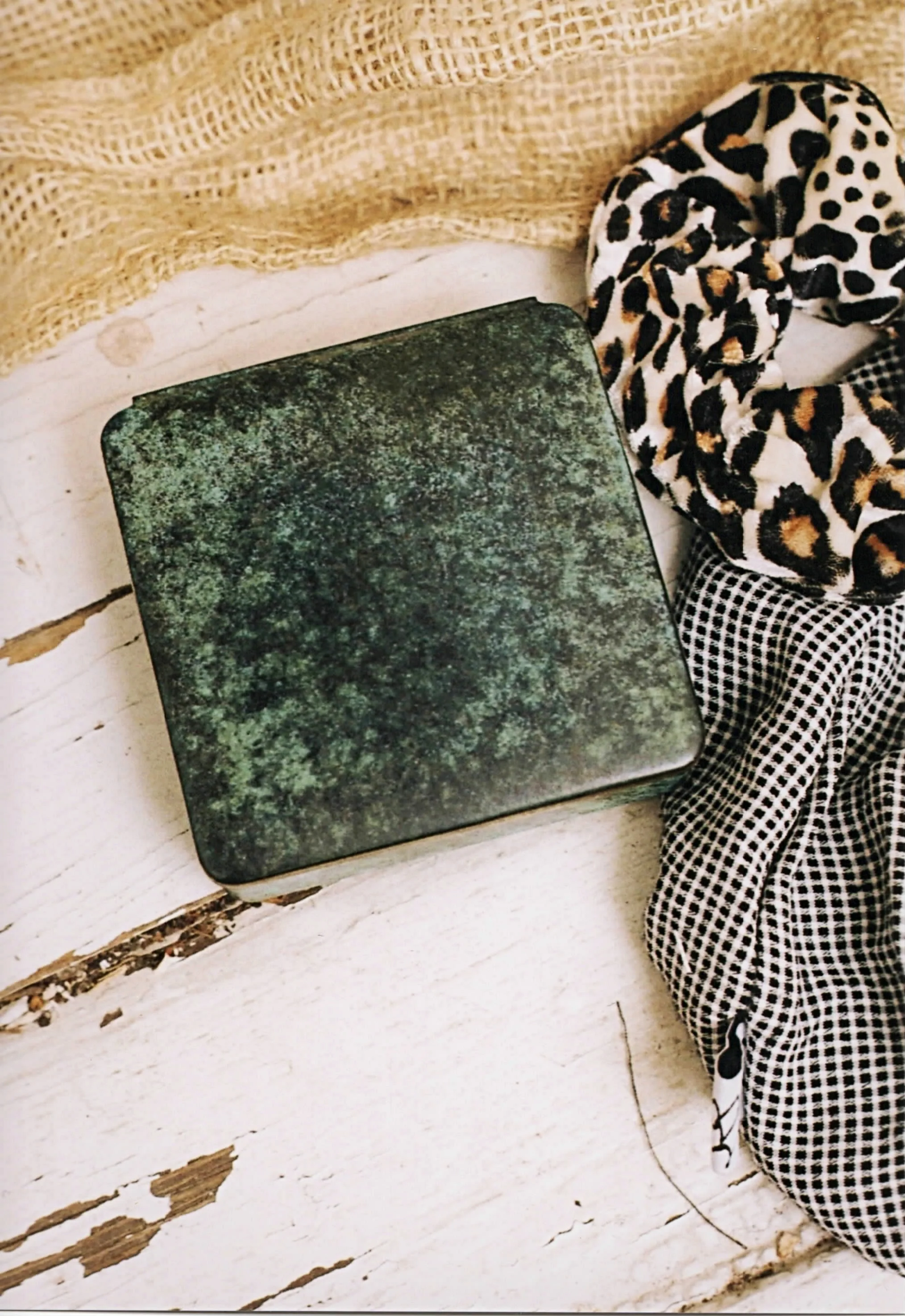 green marbled wood and brass casket