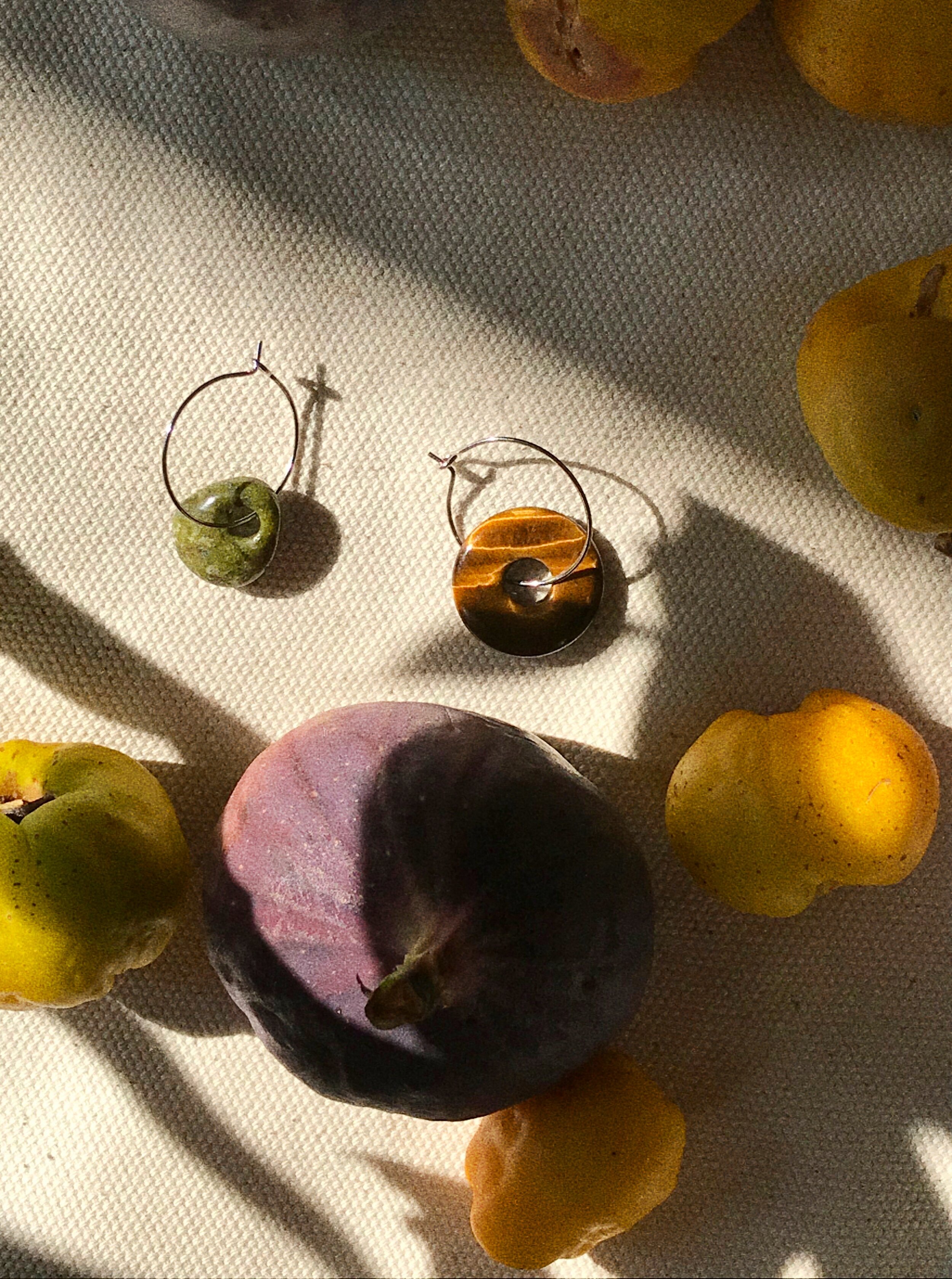 silver hoops / mismatching gemstone pair