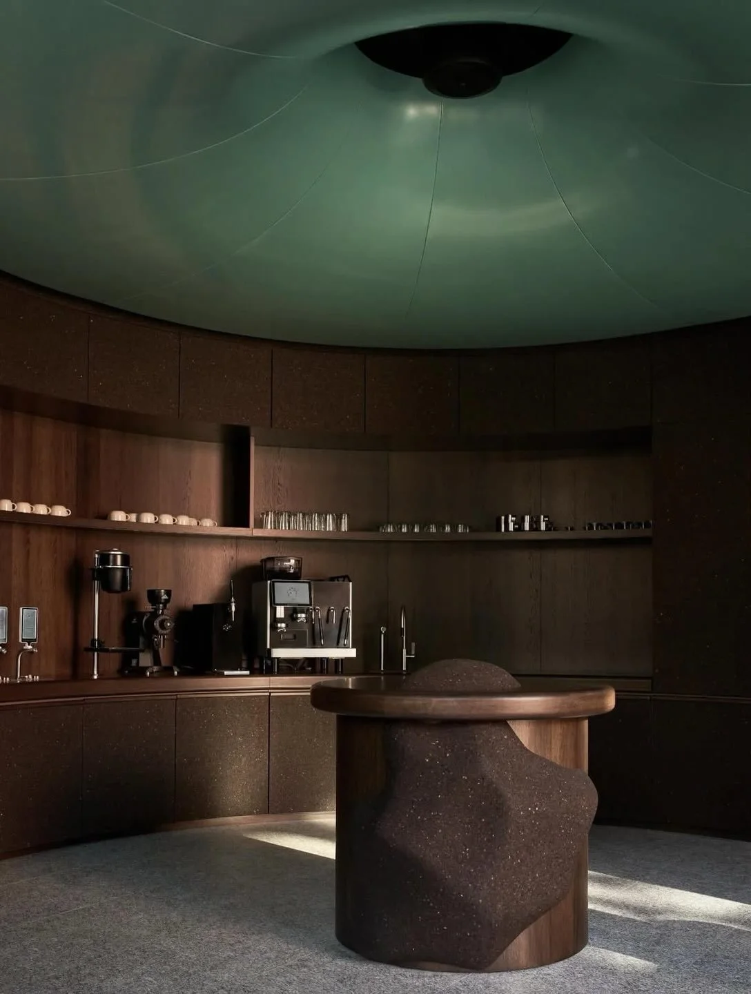 New &eacute;lan coffee bar in Oslo, designed by @snohetta.

A monolithic interior shaped by dark wood, natural cork, and a sculptural circular counter at its centre. A bespoke soundscape by @jonas_von_der_fehr completes the space.

Photography by @pe