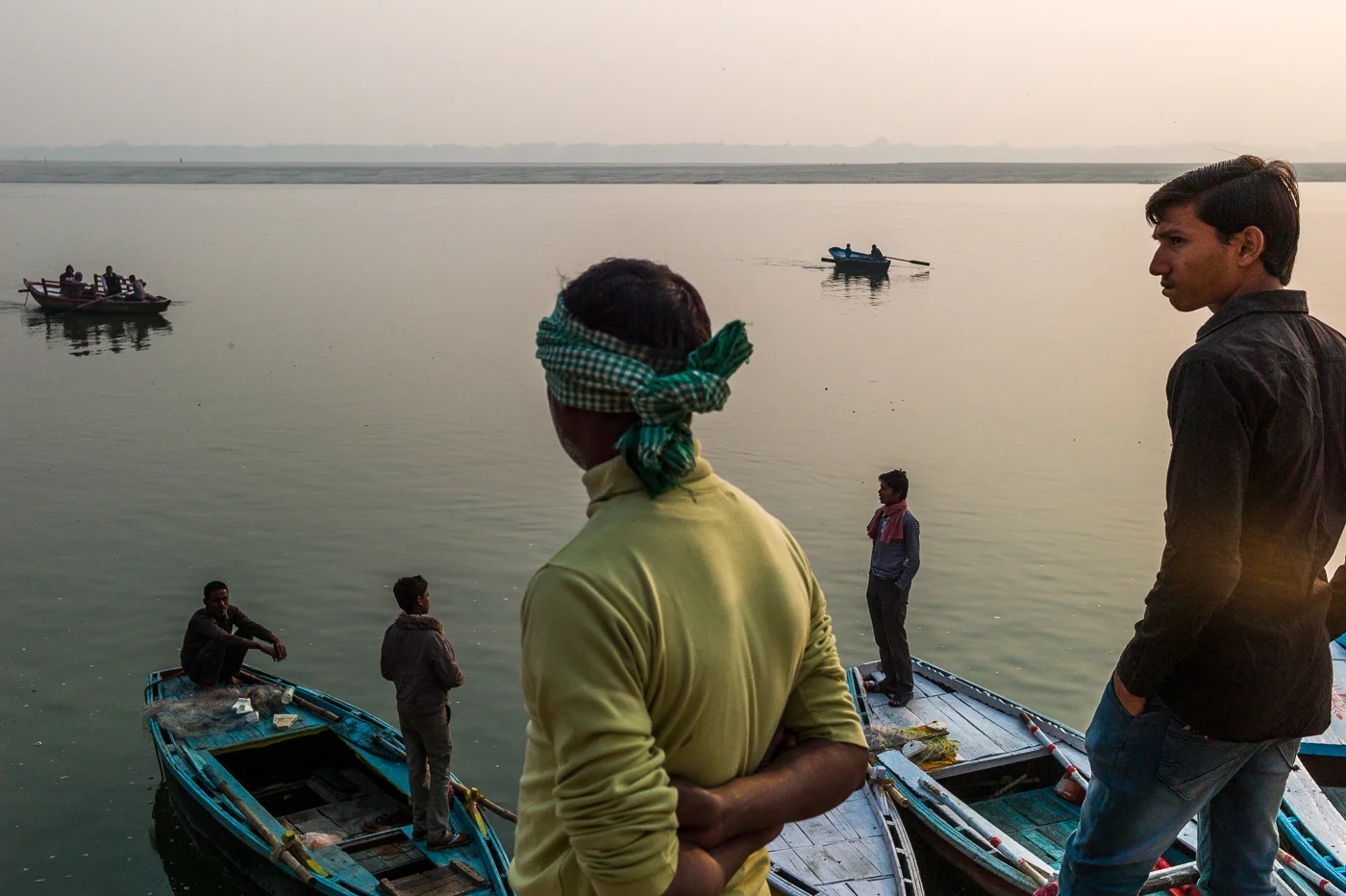 Street photography image using a Leica M9 and a 35mm lens to capture people within public life in Varanasi Ganges.