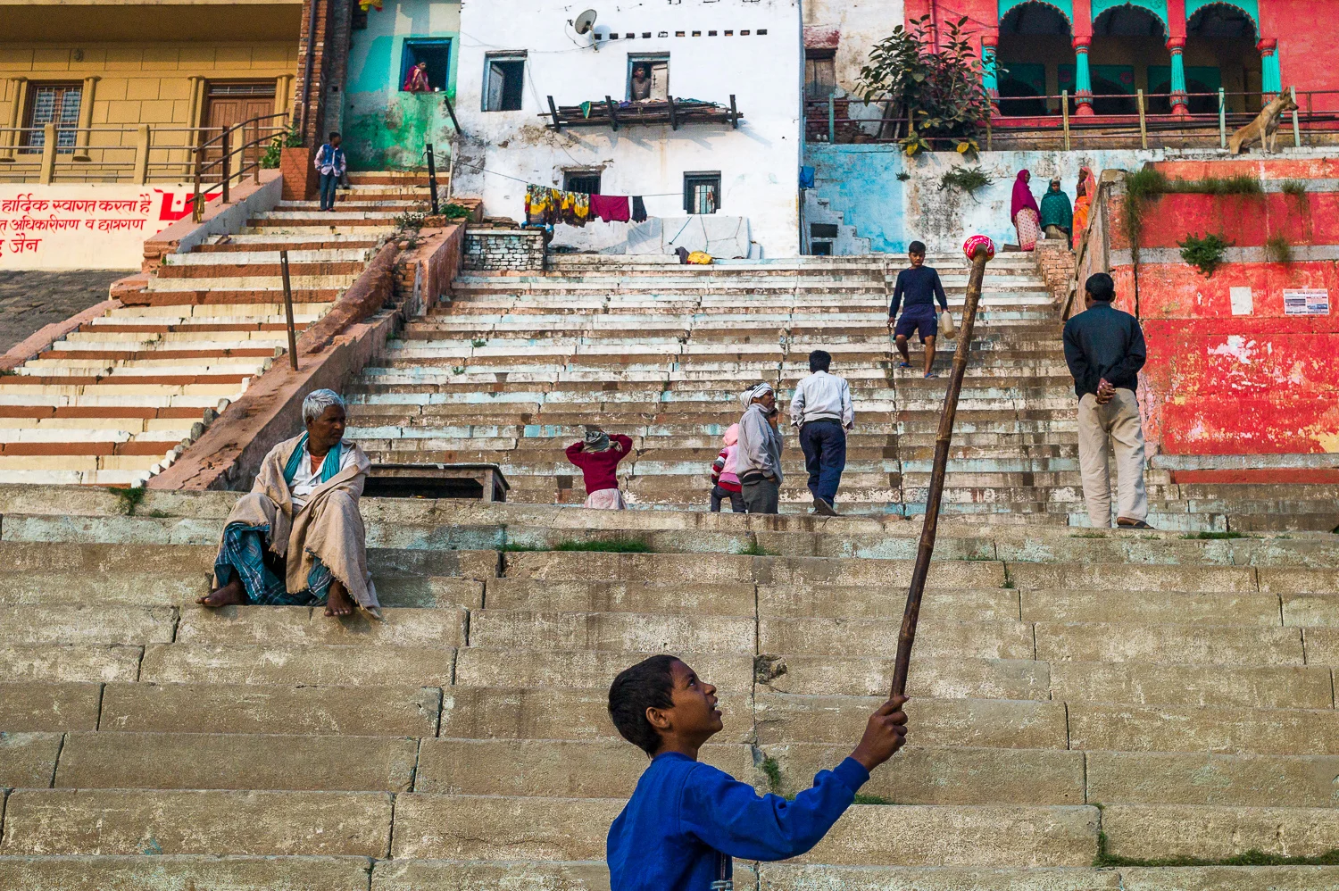 Varanasi boy playful near stairs in front of the Ganges