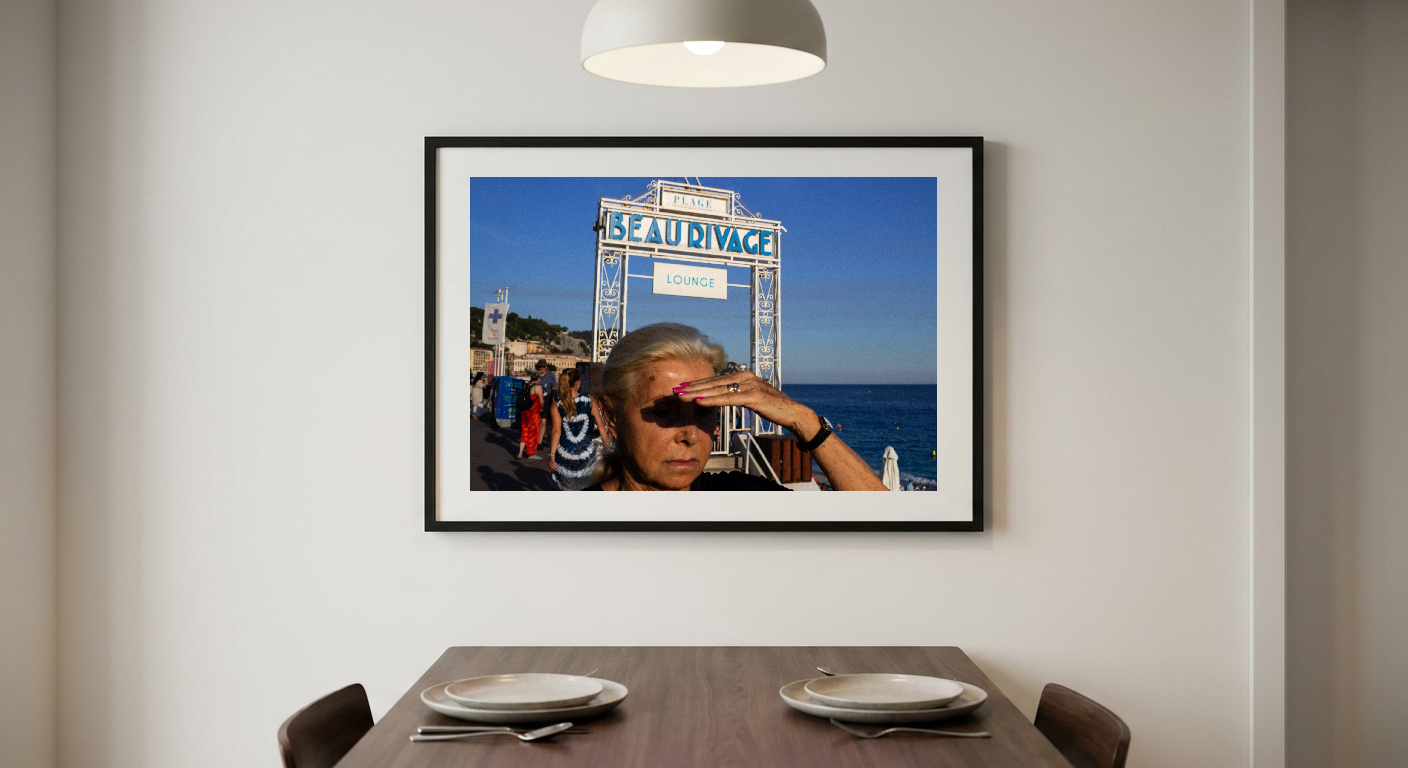 A blonde woman shields her eyes from the sun near a "BEAU RIVAGE LOUNGE" sign with the ocean behind her.