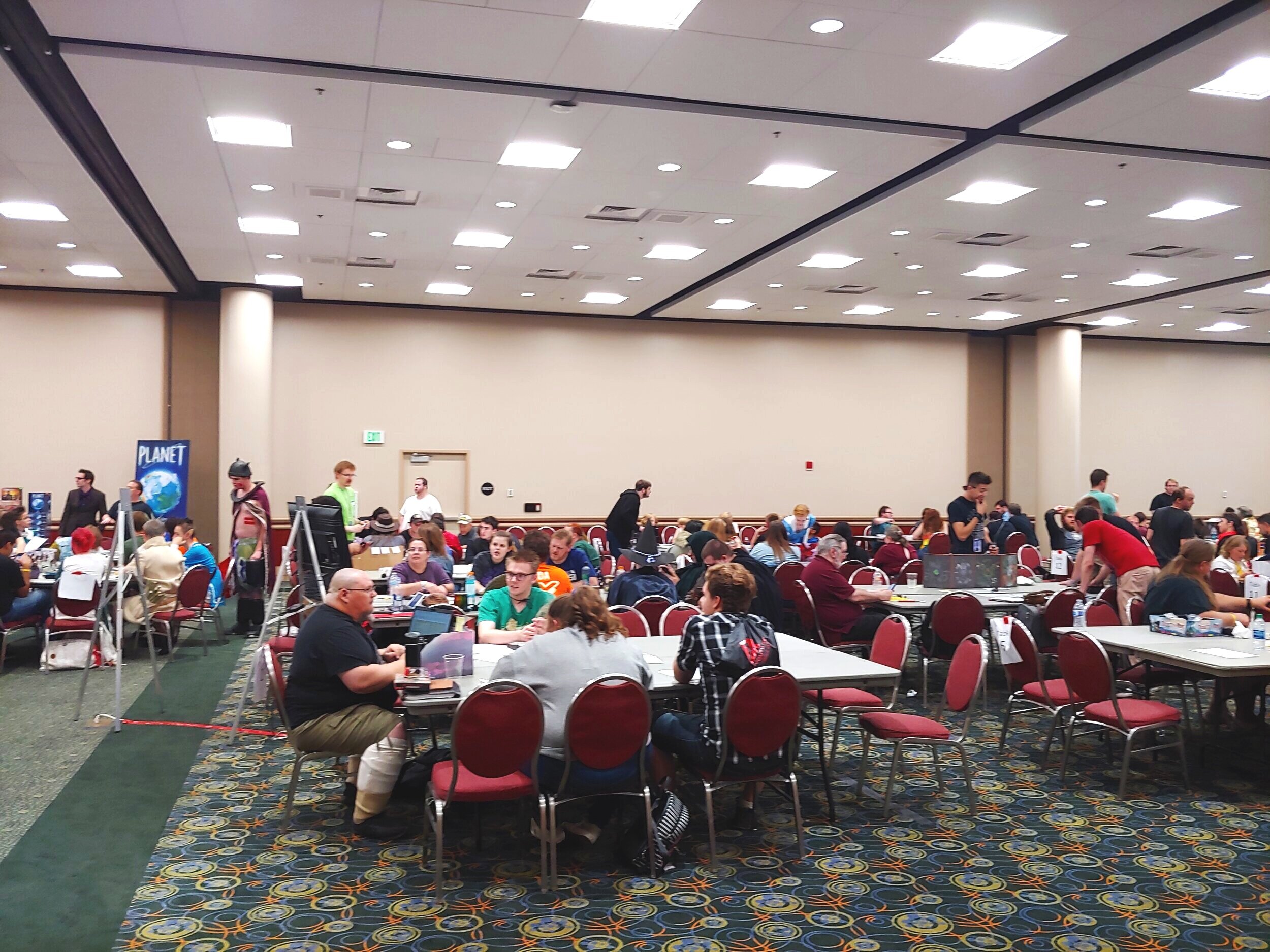Large crowd playing tabletop games at FanX