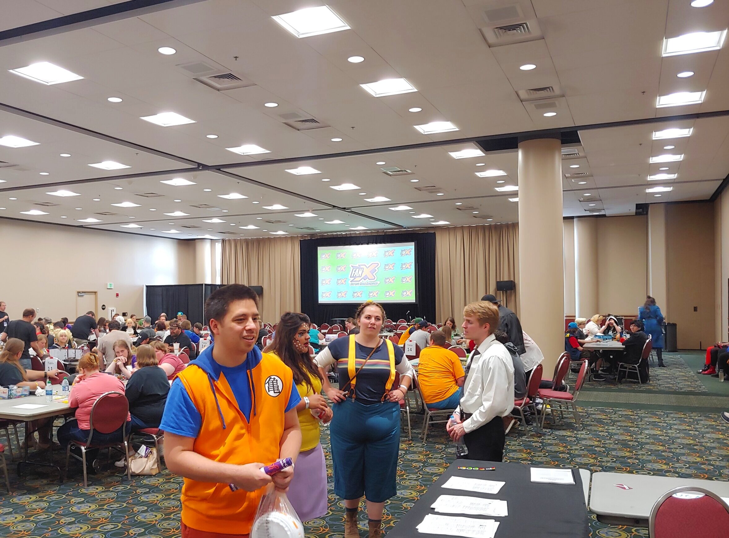 FanX guests bidding on items in charity auction