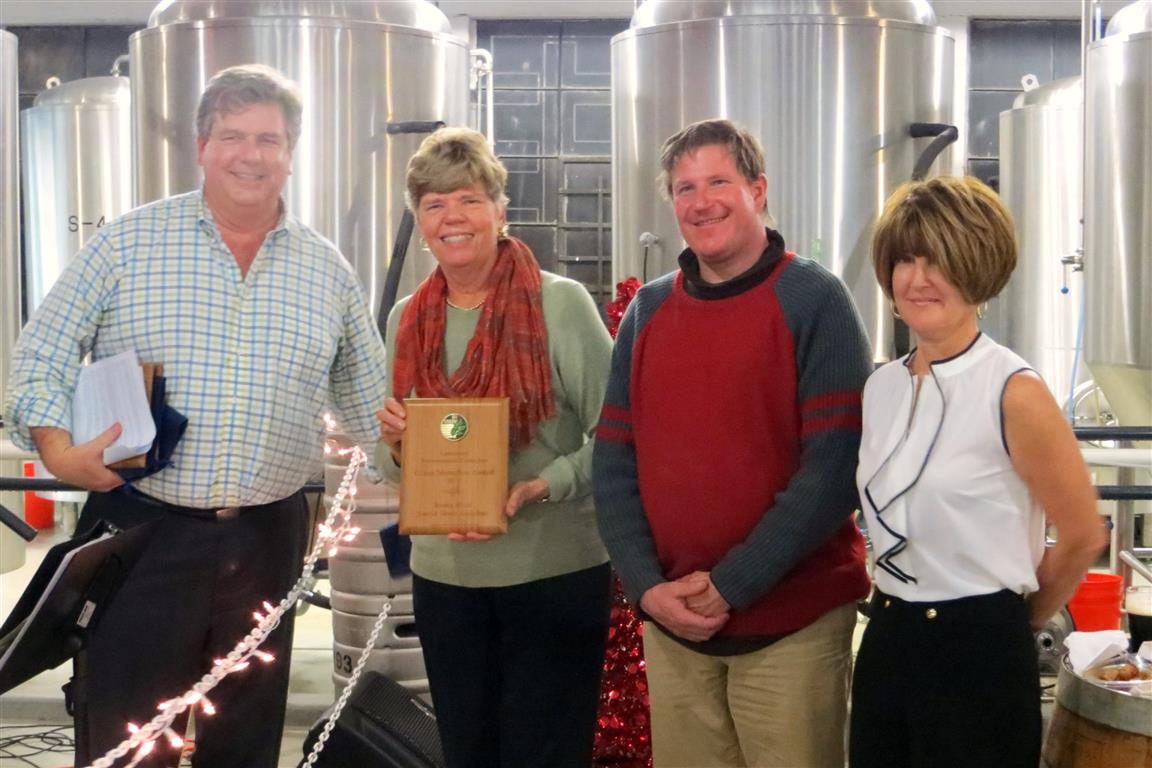 Peter McCartt, chair of the Eastchester Environmental Committee, presents the award to BRSS members Sandy Morrissey, Bernie Conway and Diane Morrison
