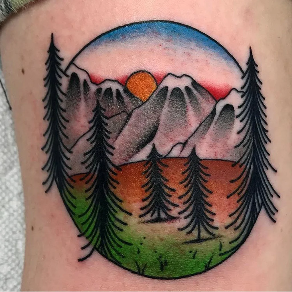 Custom Traditional Mountain Scene with Sunsetting Tattoo by Shane Rogers at Certified Tattoo Studios Denver Co .jpg