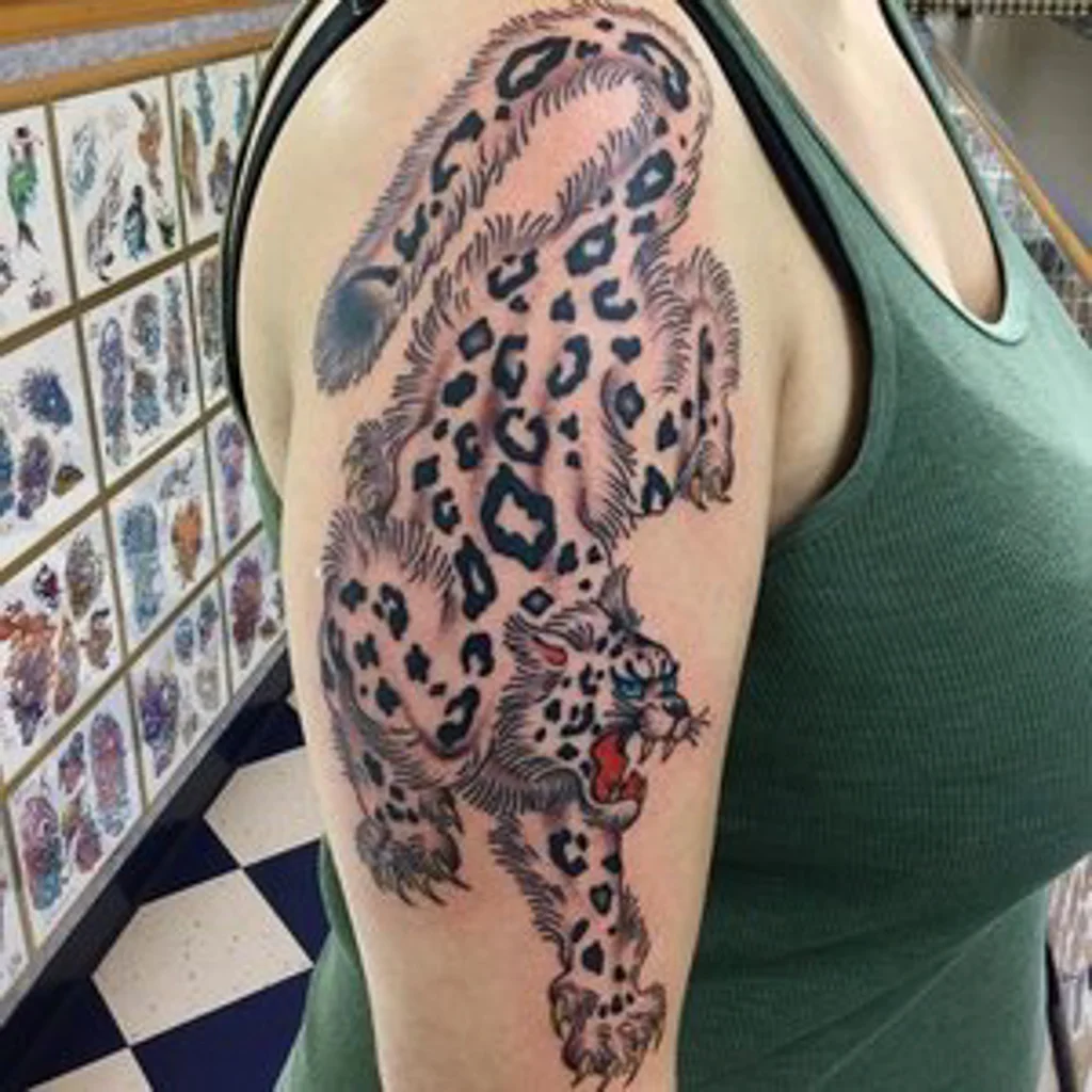 Custom Color Leapord Tattoo by Shane Rogers at Certified Tattoo Studios in Denver.jpg