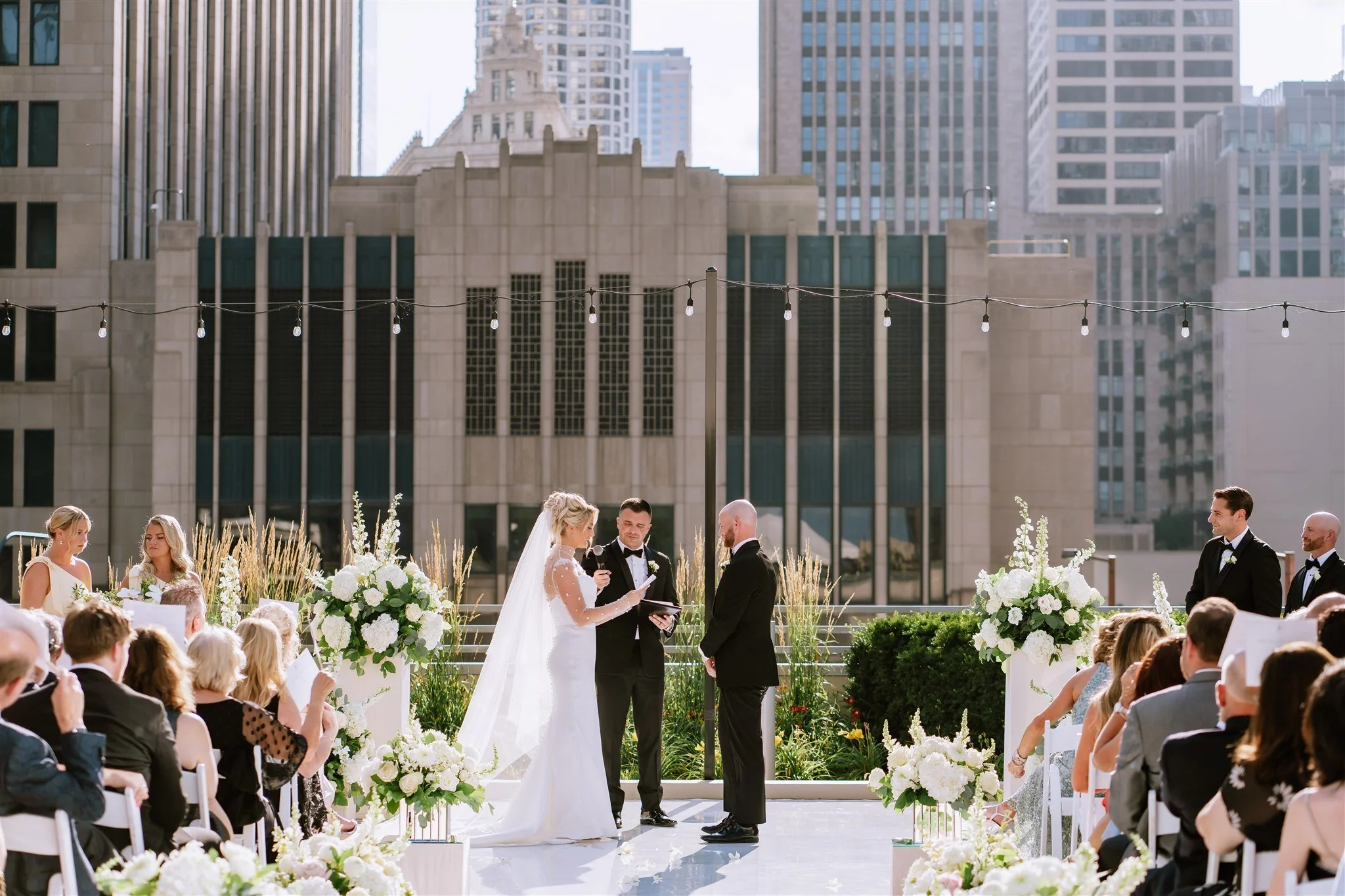 Bride and groom say vows at Loews Chicago rooftop wedding ceremony