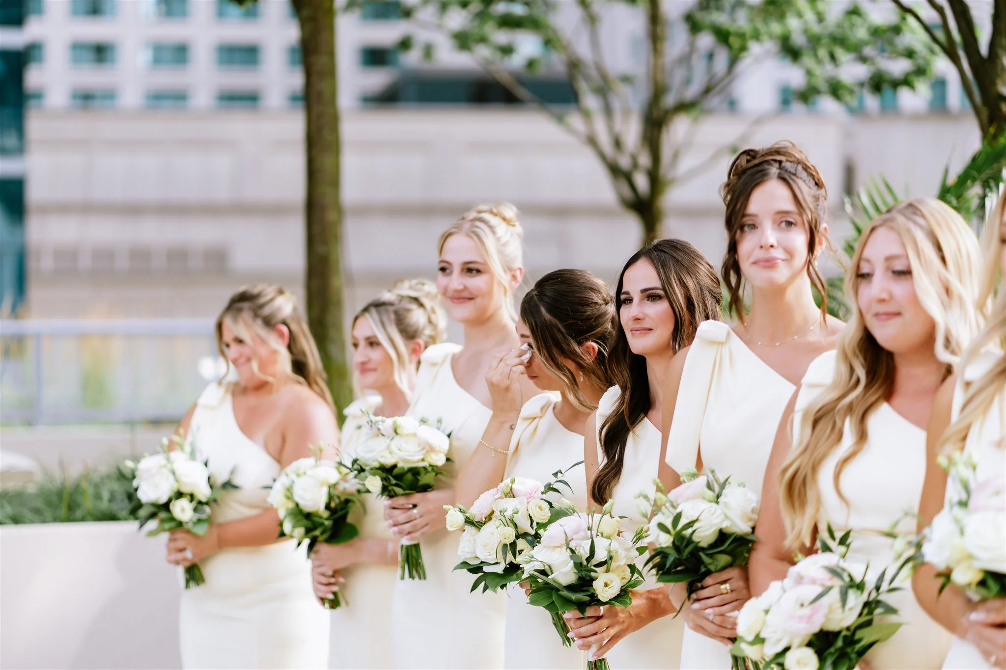 Bridal party cries during vows on rooftop terrace at Loews Chicago
