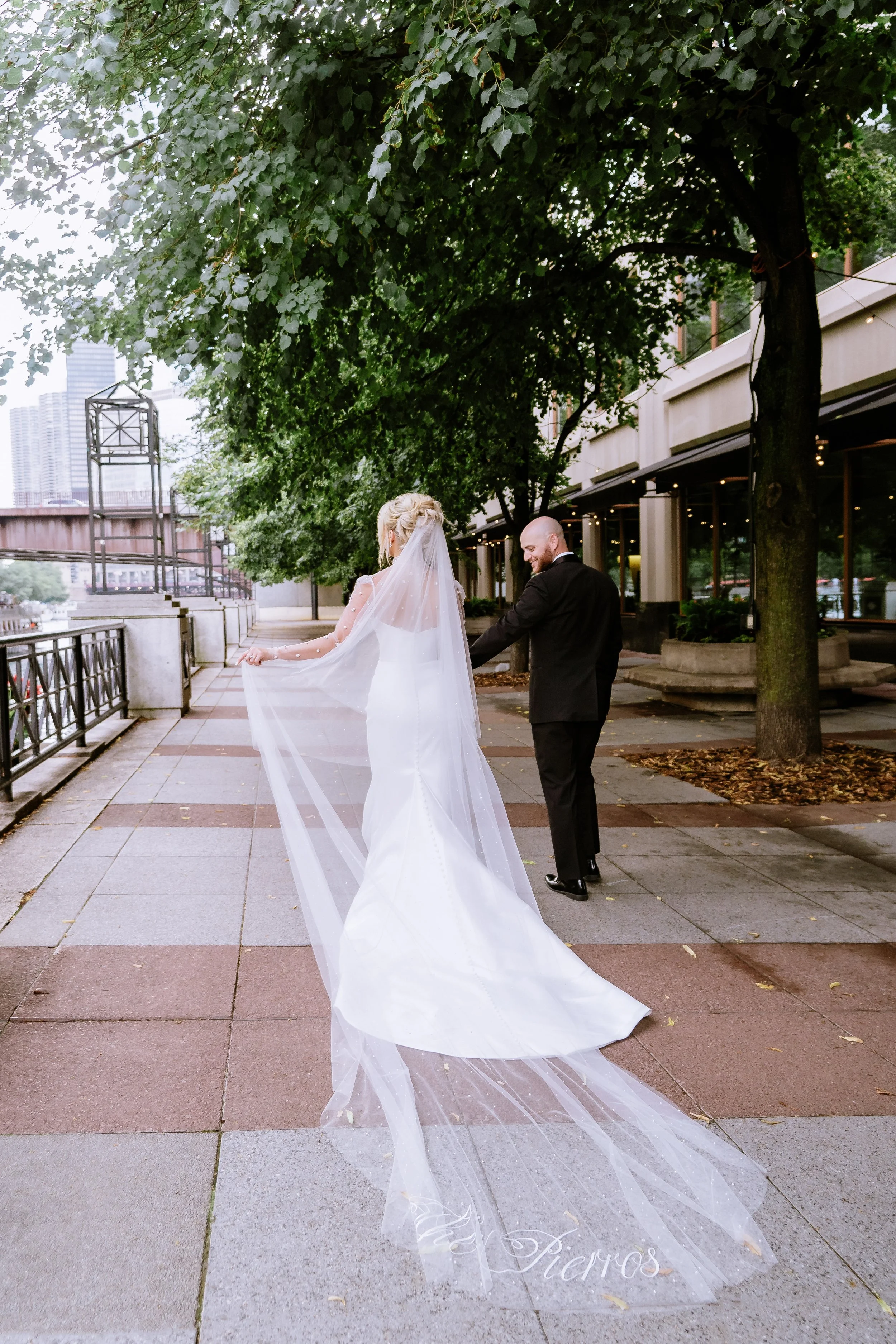 Couple walking around Chicago on their Loews Chicago wedding day