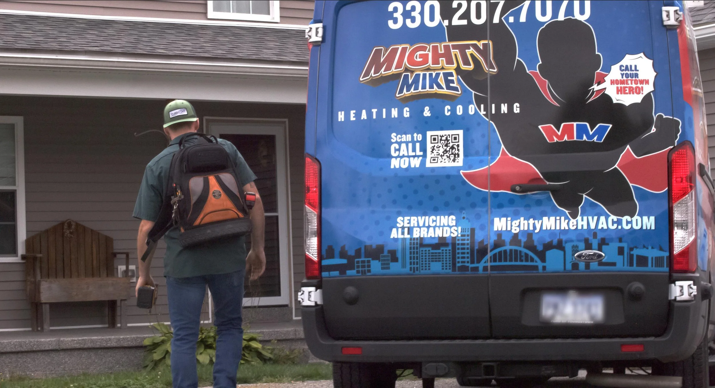 A Mighty Mike service technician on his way to fix or replace a customer's furnace or air conditioning