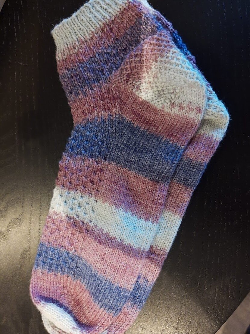 First time darning, I'm pretty happy with it. I've had these socks for a  decade and I'm not giving up on them now! : r/Visiblemending