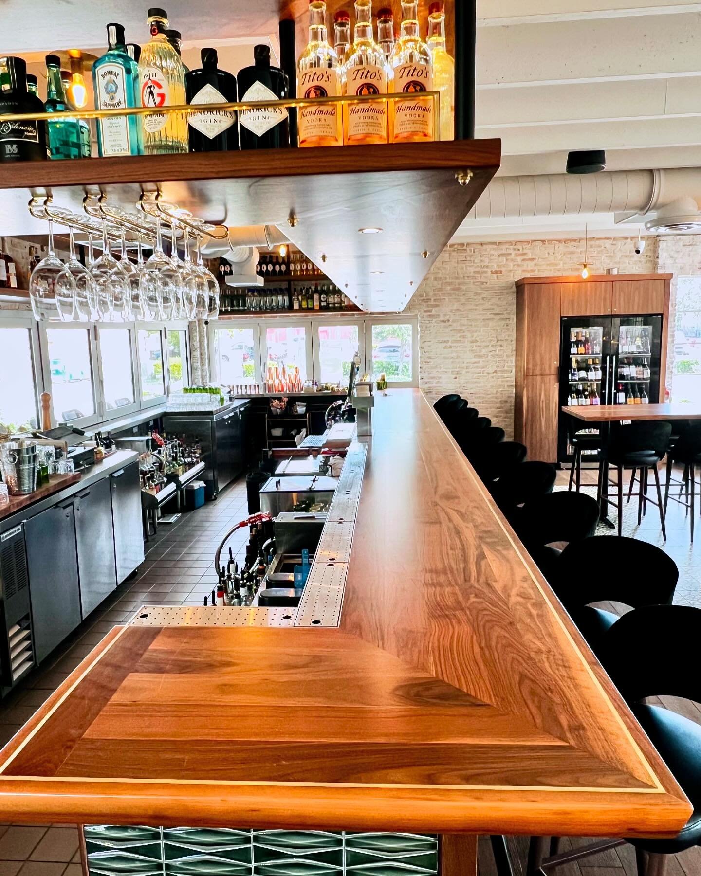 the gold lining⁣
⁣
// Southern hospitality dictated that we build a walnut bar with gold inlay and over bar with walnut  shelving, LED and puck lighting, and brass details for contemporary Southern American concept @southpmp