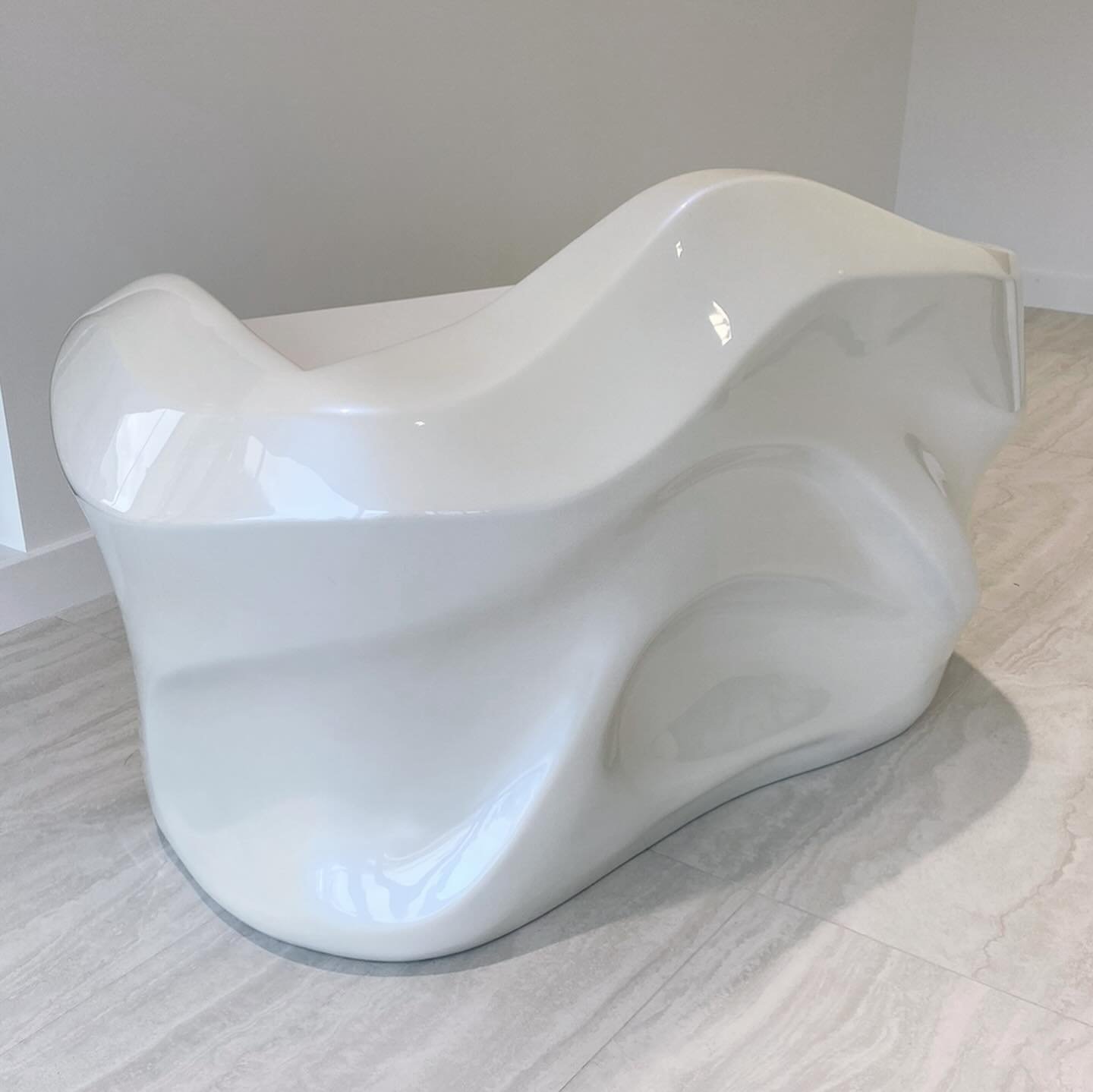 ⚪️ out⁣
⁣
// Hand sculpted, organic form front desk with pearl automotive finish and drawers.