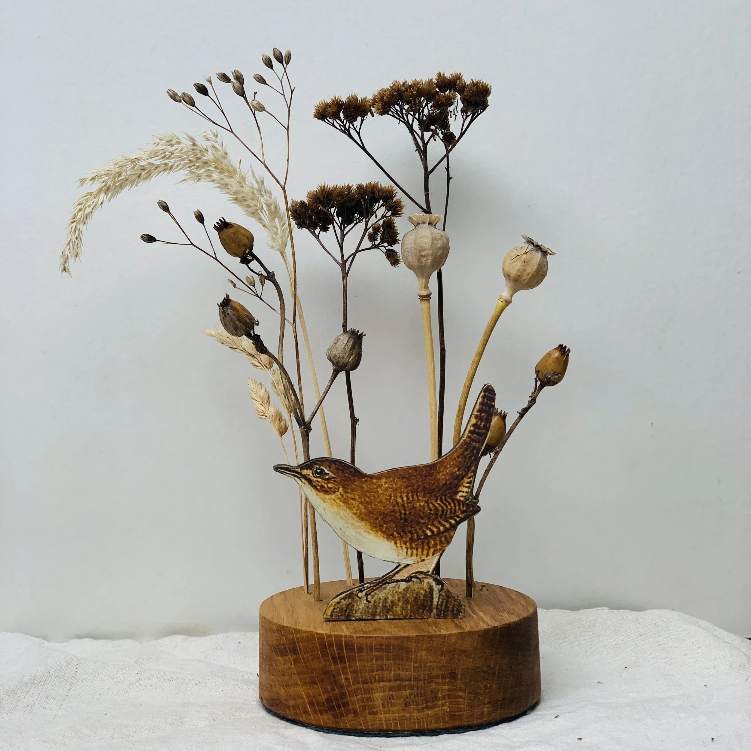 Dried flower display with robin