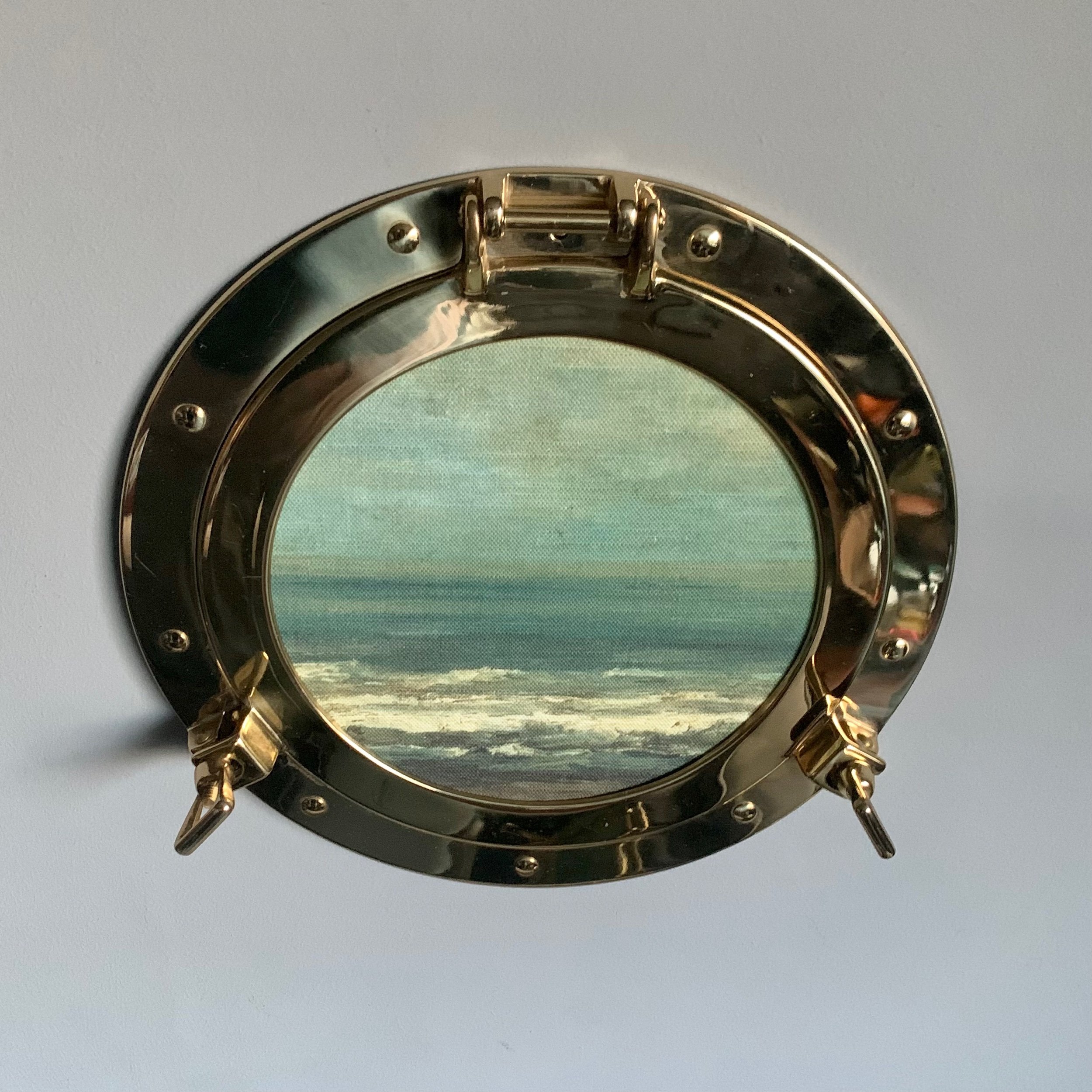 brass porthole seascape.jpeg