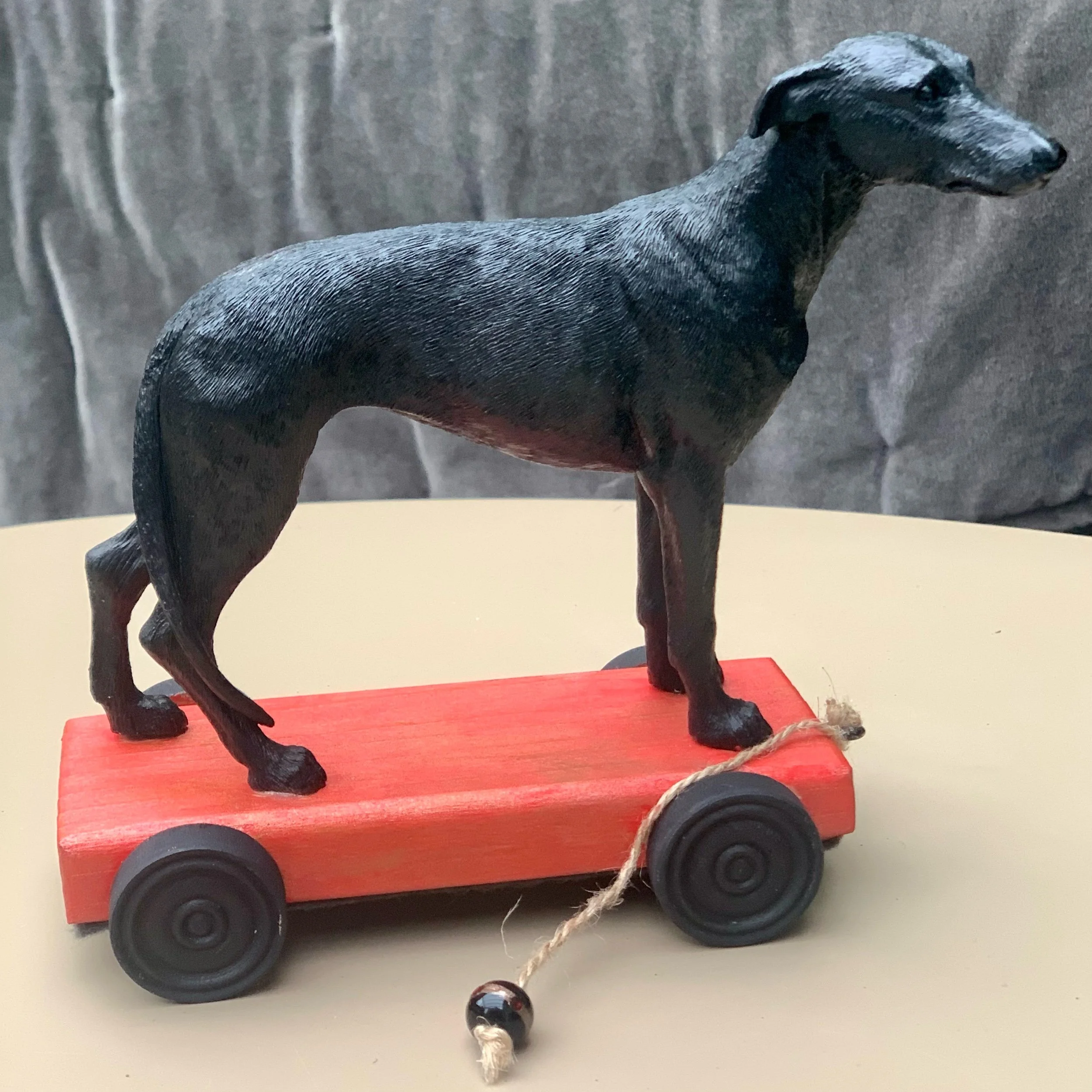 greyhound dog on wheels.jpeg