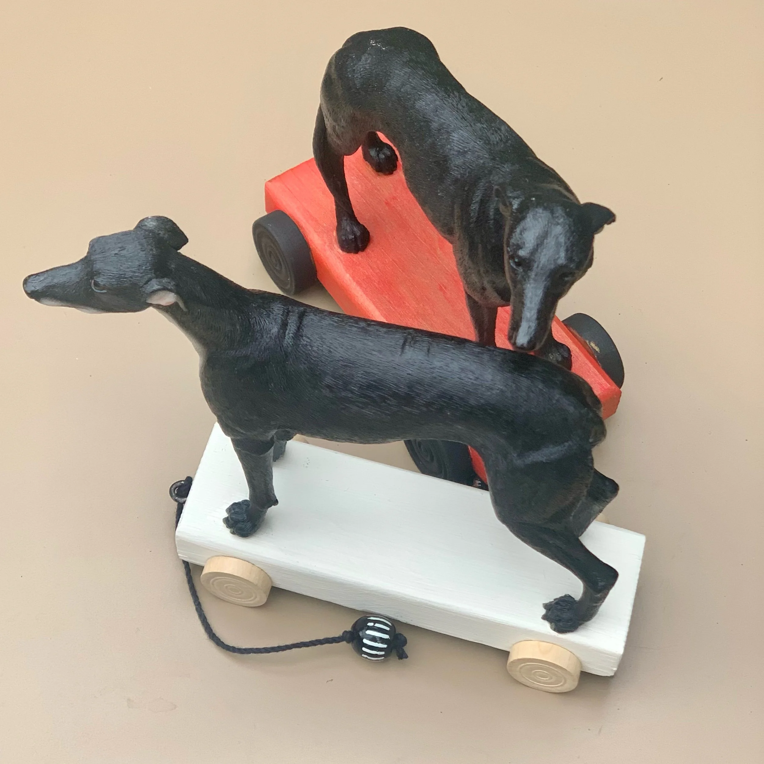 greyhound dogs on wheels.jpeg