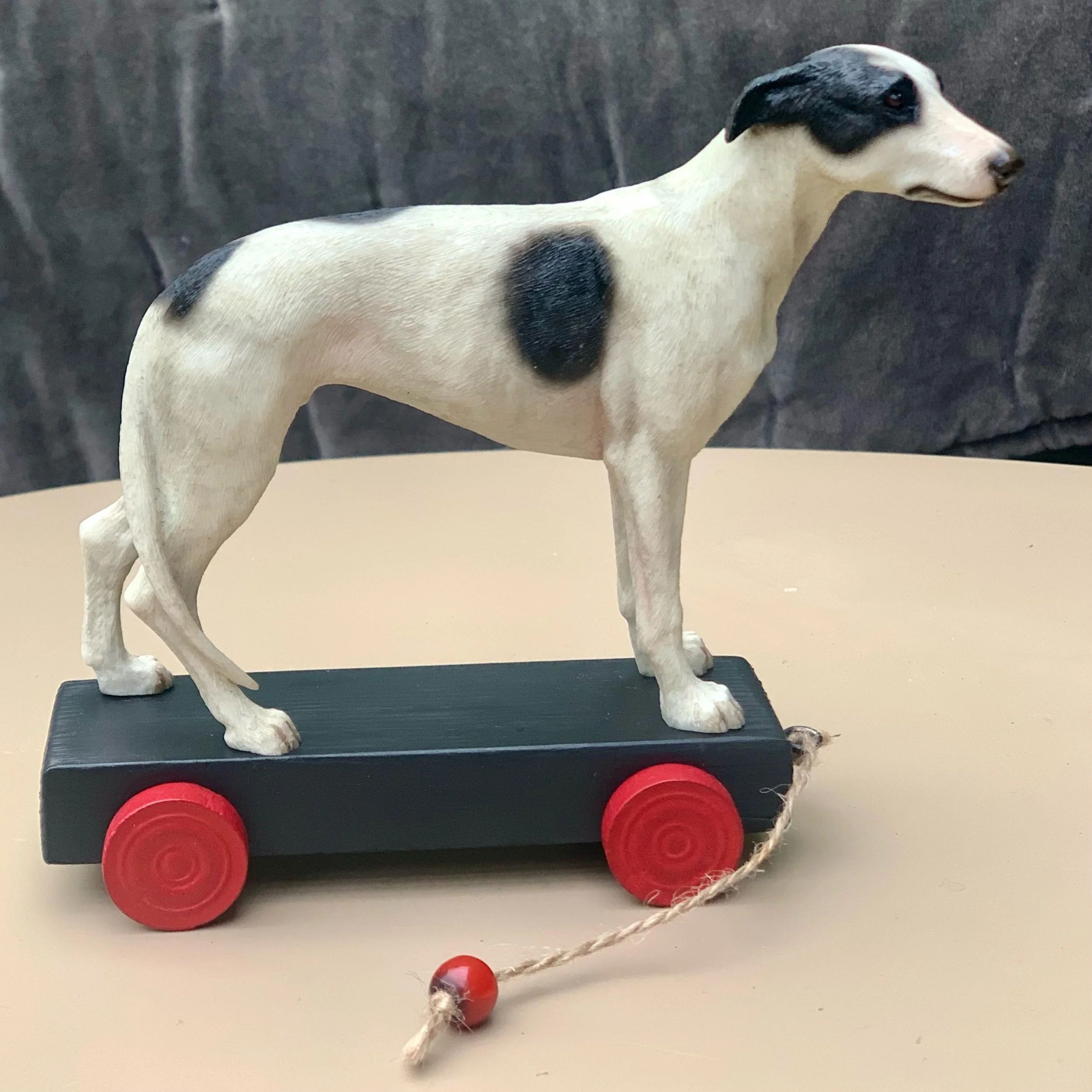greyhound dog on wheels.jpeg