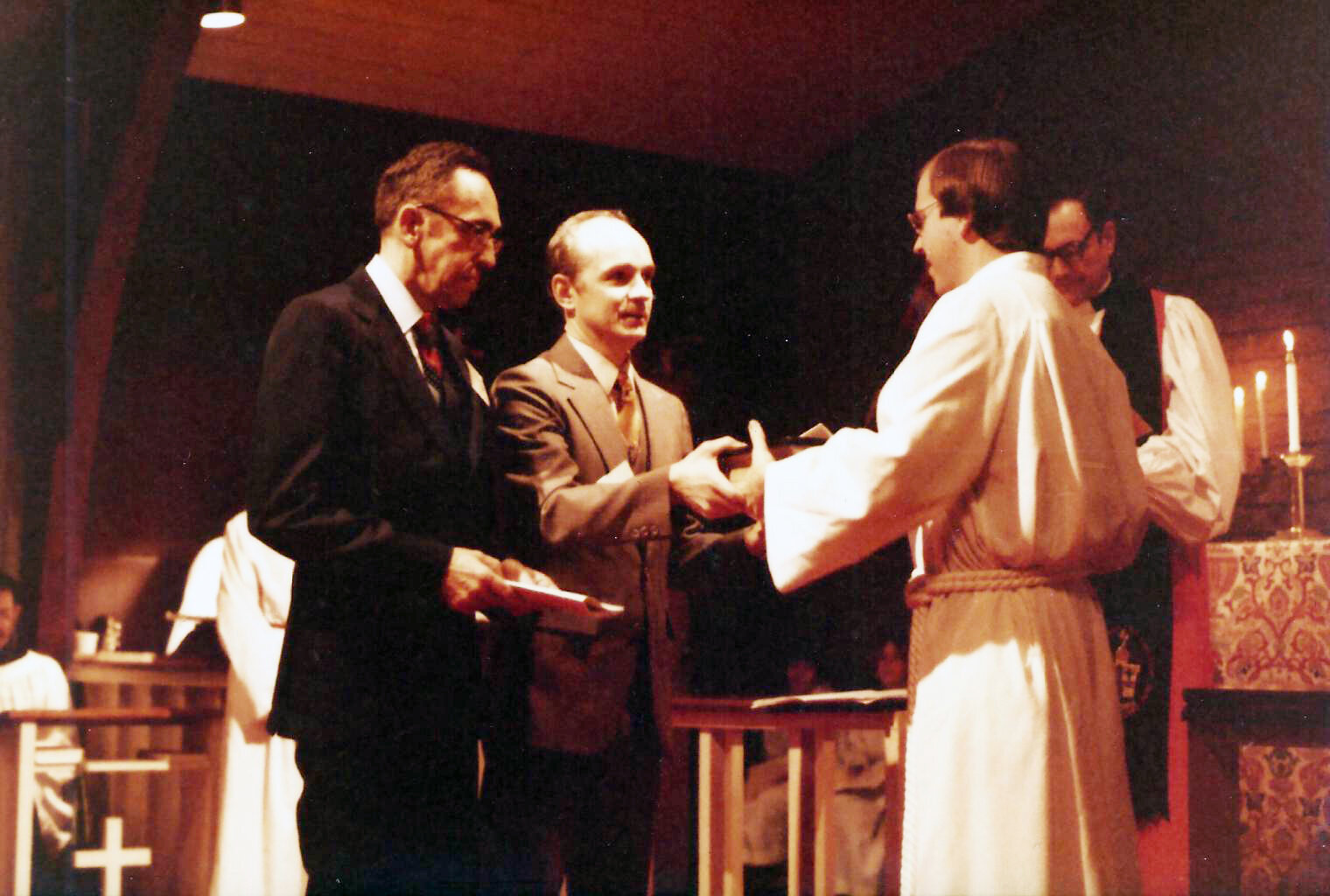  The Rev. John A.M. Guernsey (right) is installed as vicar in 1981. 