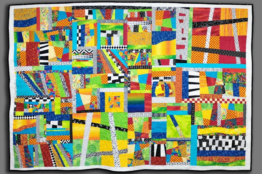  Here is a pic of the service project quilt I made. &nbsp;Hopefully bright &amp; cheerful for someone. It actually was started with a batch of scrapes from a quilt - made 8 years ago. Sue Ellen 