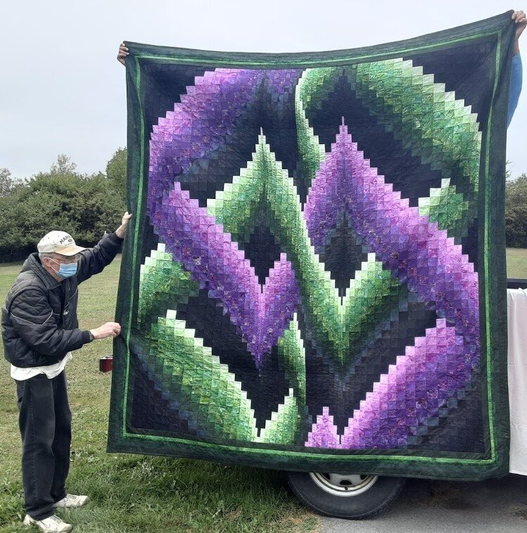   I finished my quilt for the quilt show.  It's 98 x 105. It's my last big one. Two guys held it up so I could get a photo.  Gail B. 
