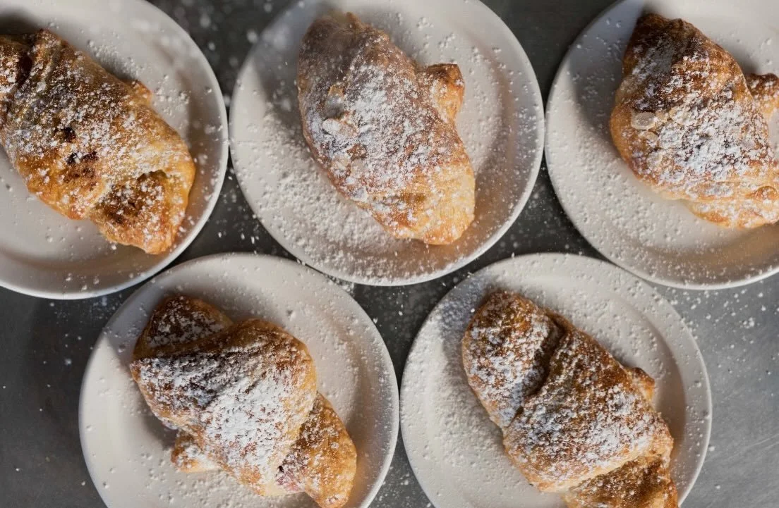 Snow day! Cozy up with warm, freshly baked pastries, coffee, or a warm panini on this snowy day! We can&rsquo;t wait to see you ☃️❄️

Pictured above is our almond croissants, available daily. 

#breadandchocolatemn #bakedfresh #snowday #grandavestpau