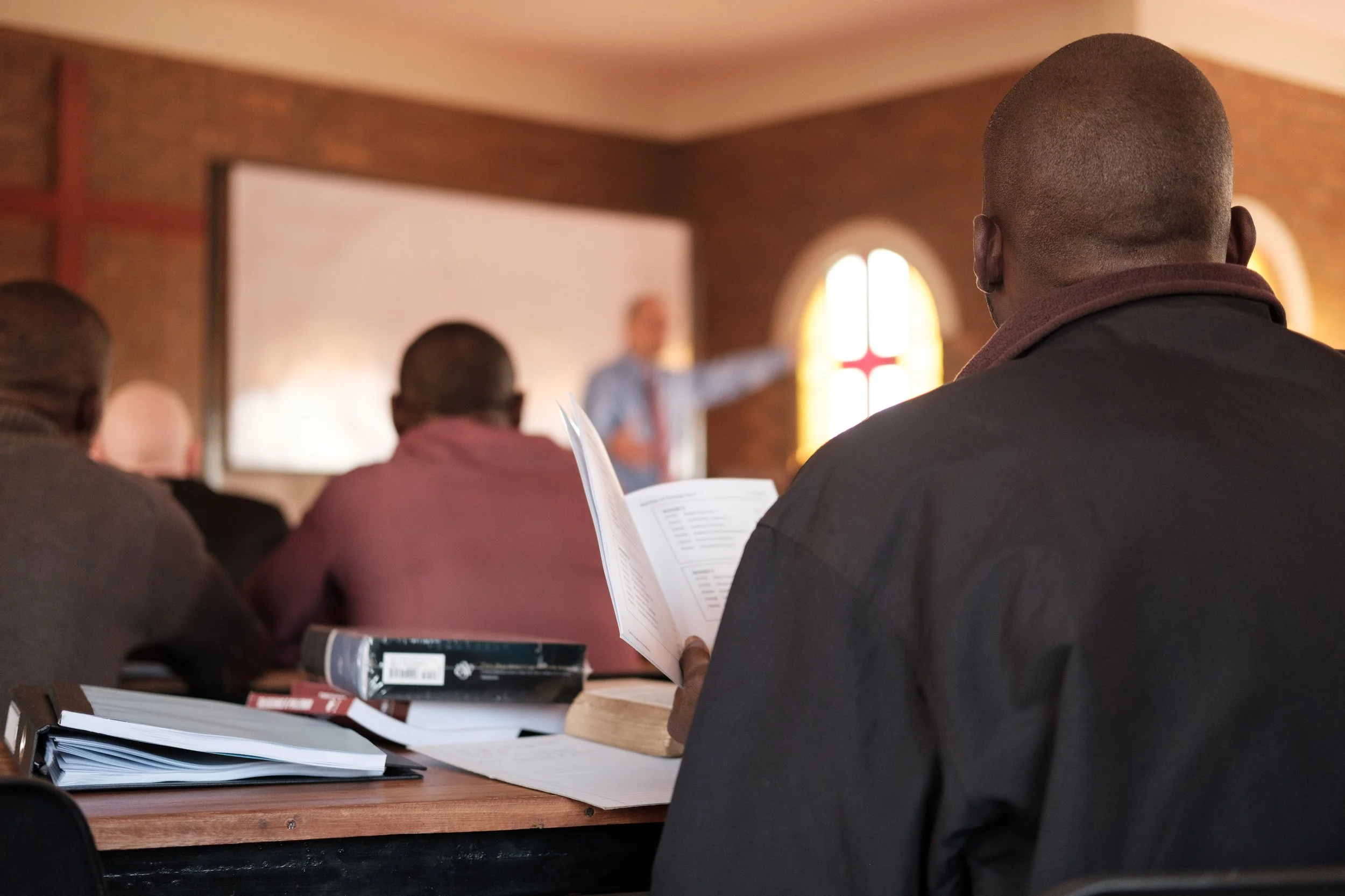 Student follows along with professor Dave Temple in the student handbook.