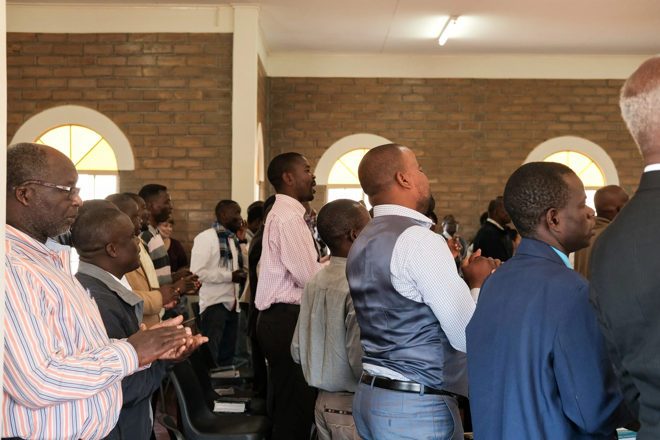 Students sing traditional Malawian worship music to praise God during chapel.
